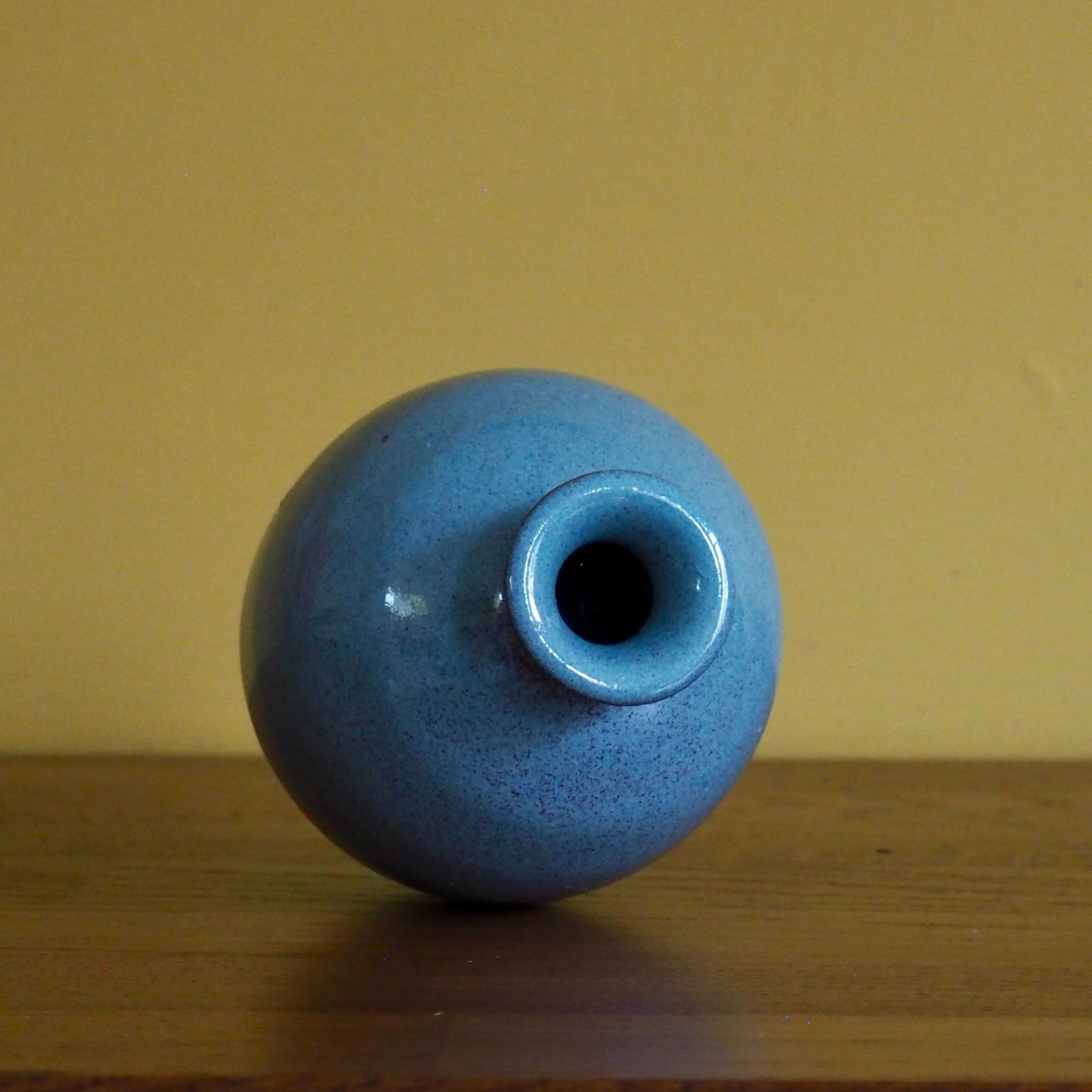 small blue glazed urn stem vase