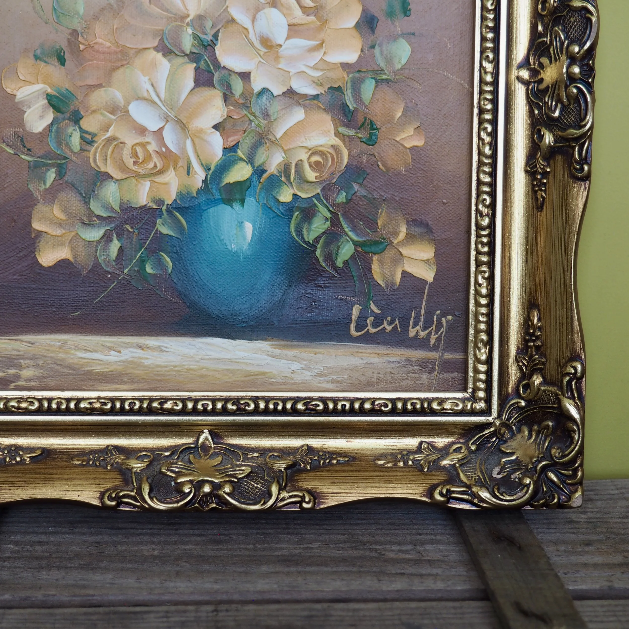 close up of oil painting of roses in a vase