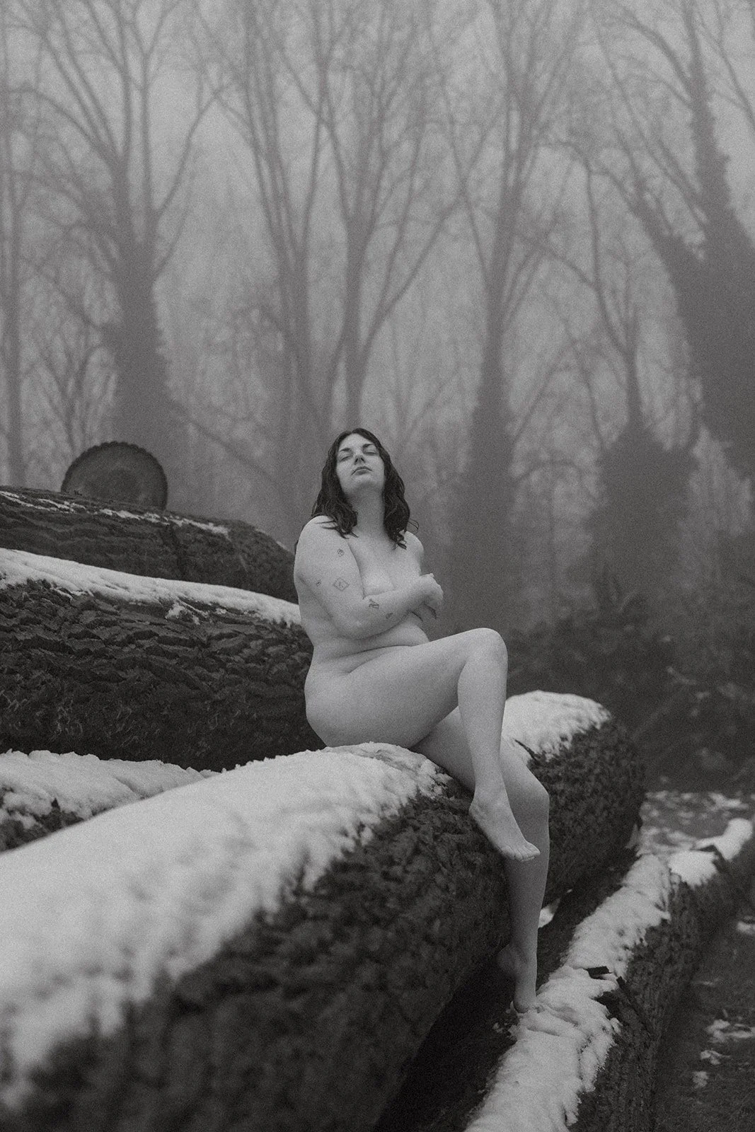 soft cinematic boudoir image in the snow in Belgium