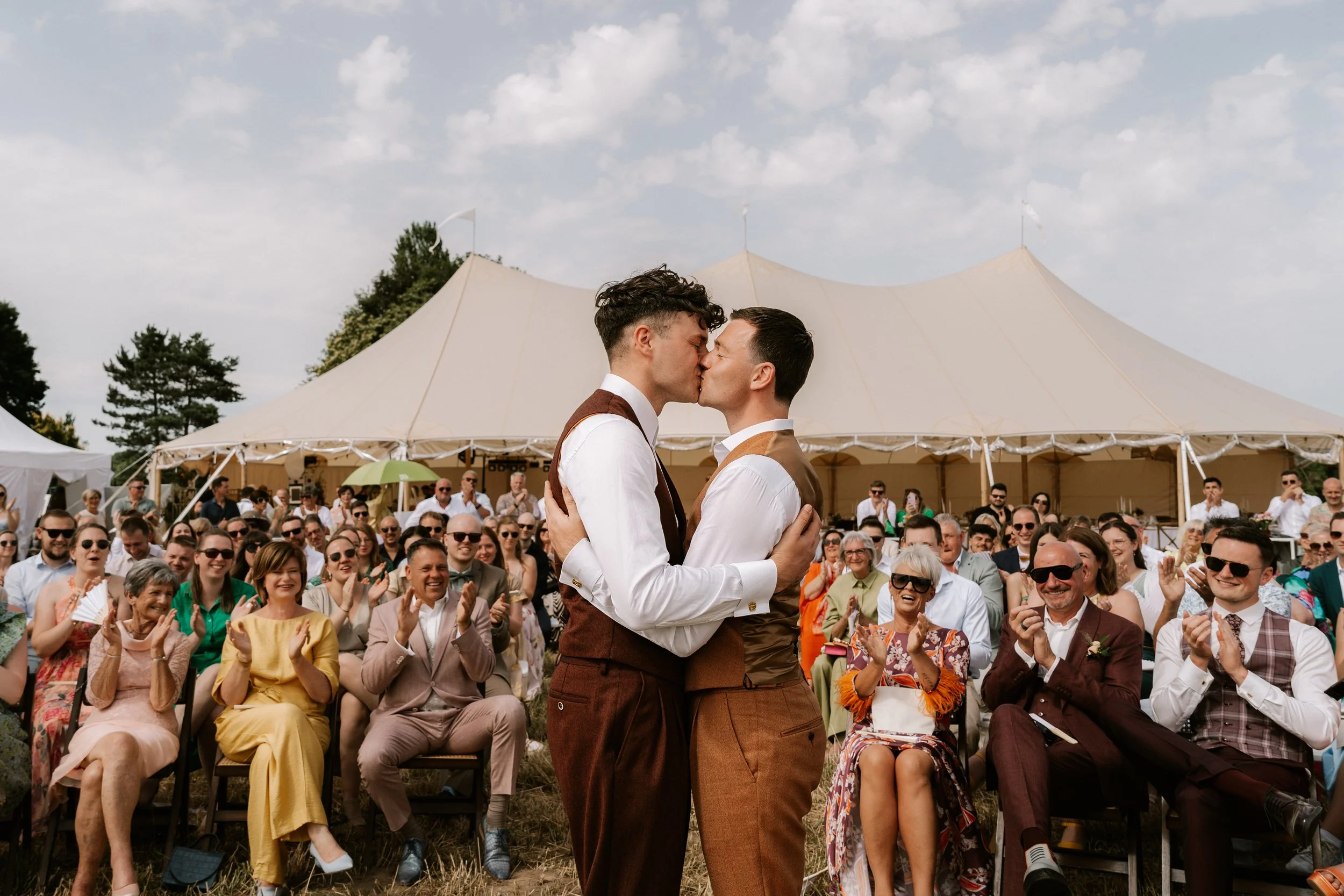 groom and groom kiss during their ceremony