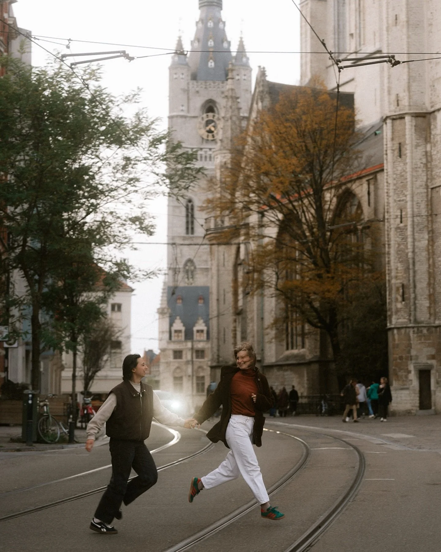 Golden hour in Ghent. 
Two women, autumn light, and a city that quietly played along. 

We walked. Talked. Let the sun slide between stone and shadow. 
No poses to remember. Just moments. 
The kind that linger. 

Take your time swiping. 
There&rsquo;