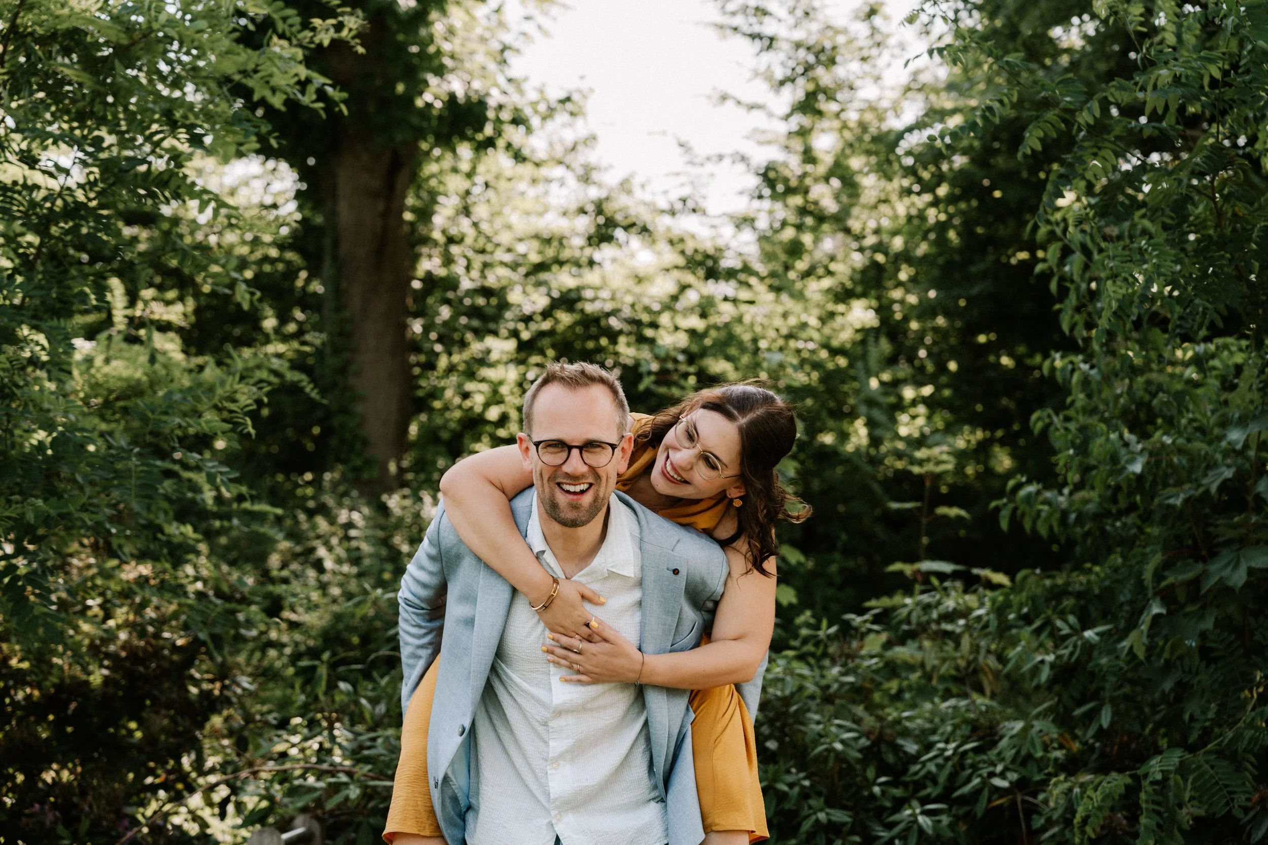 wedding couple hugging during photoshoot in nature