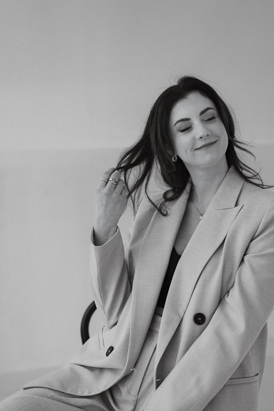 Female entrepreneur photographed in a minimalist studio for branding purposes