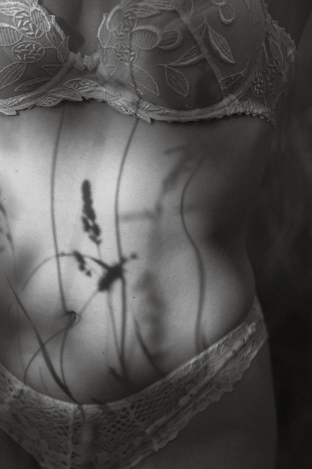 soft cinematic boudoir image of a woman in nature, photographed in Belgium