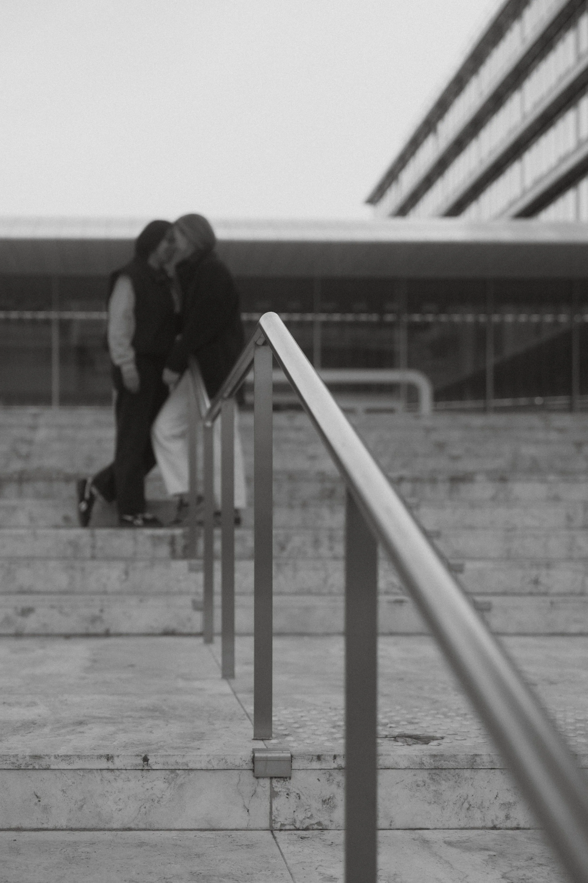 lesbian couple standing close to each other in Ghent during an intimate photoshoot