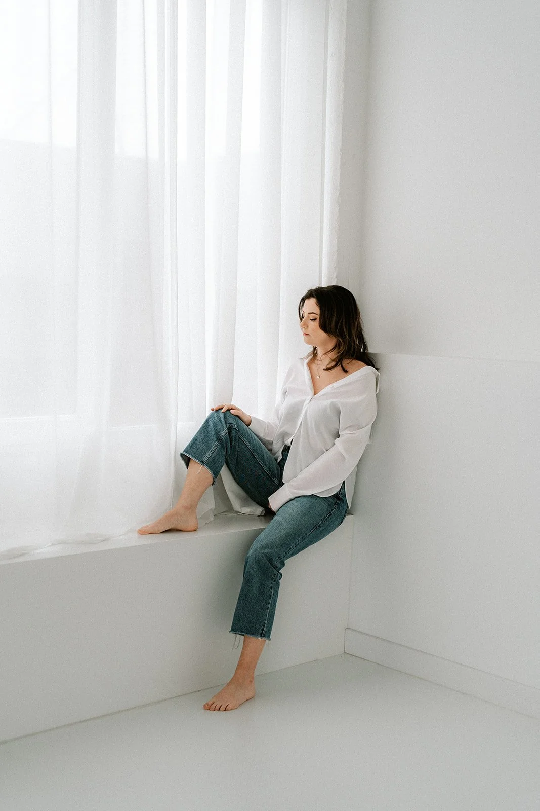 Natural pose during a minimal branding photoshoot in studio light