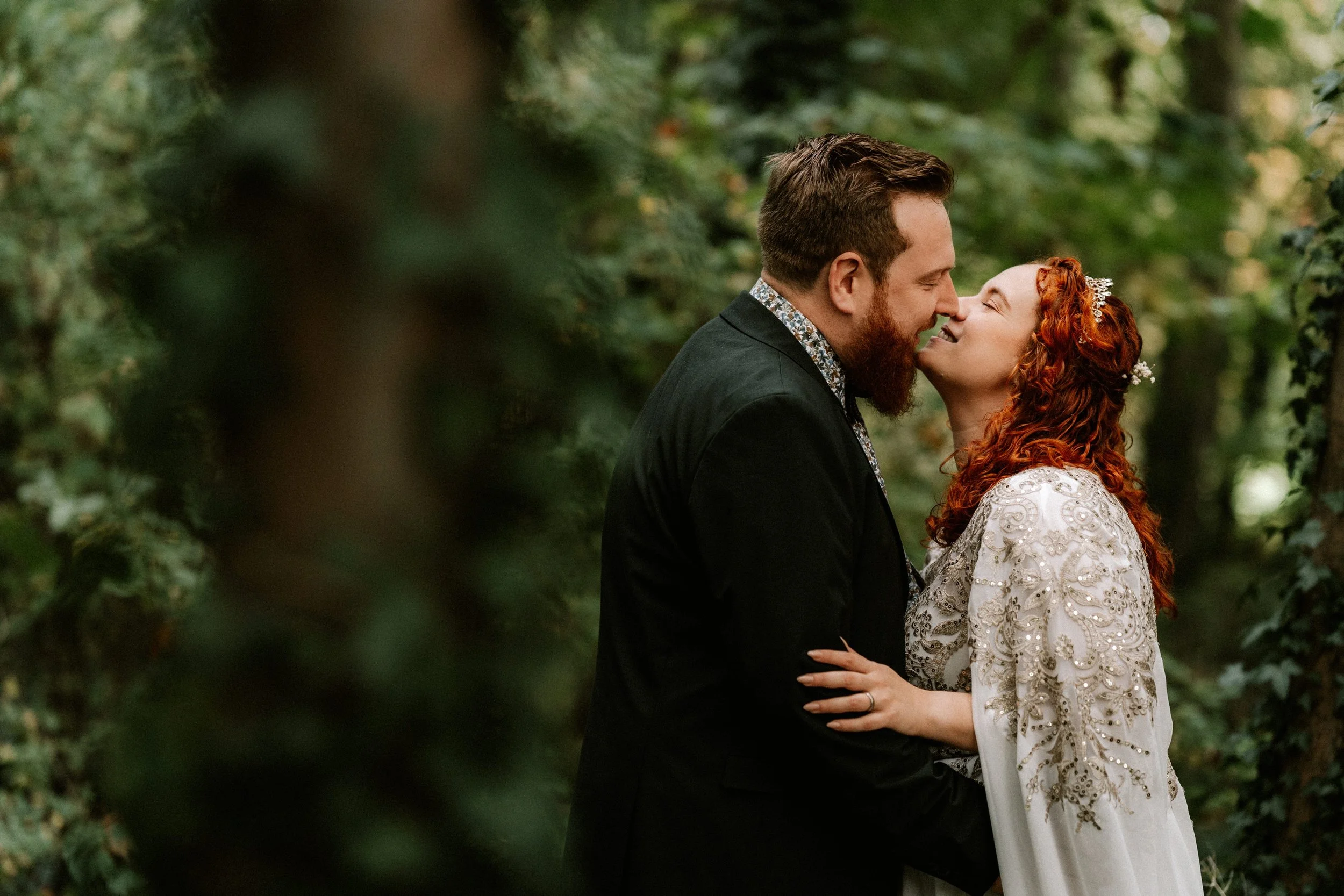 happy couple kissing during natural wedding photography