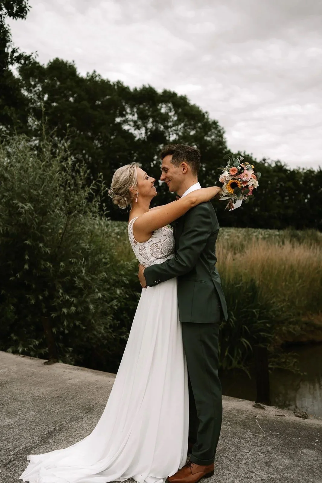 bride and groom laughing during relaxed wedding walk