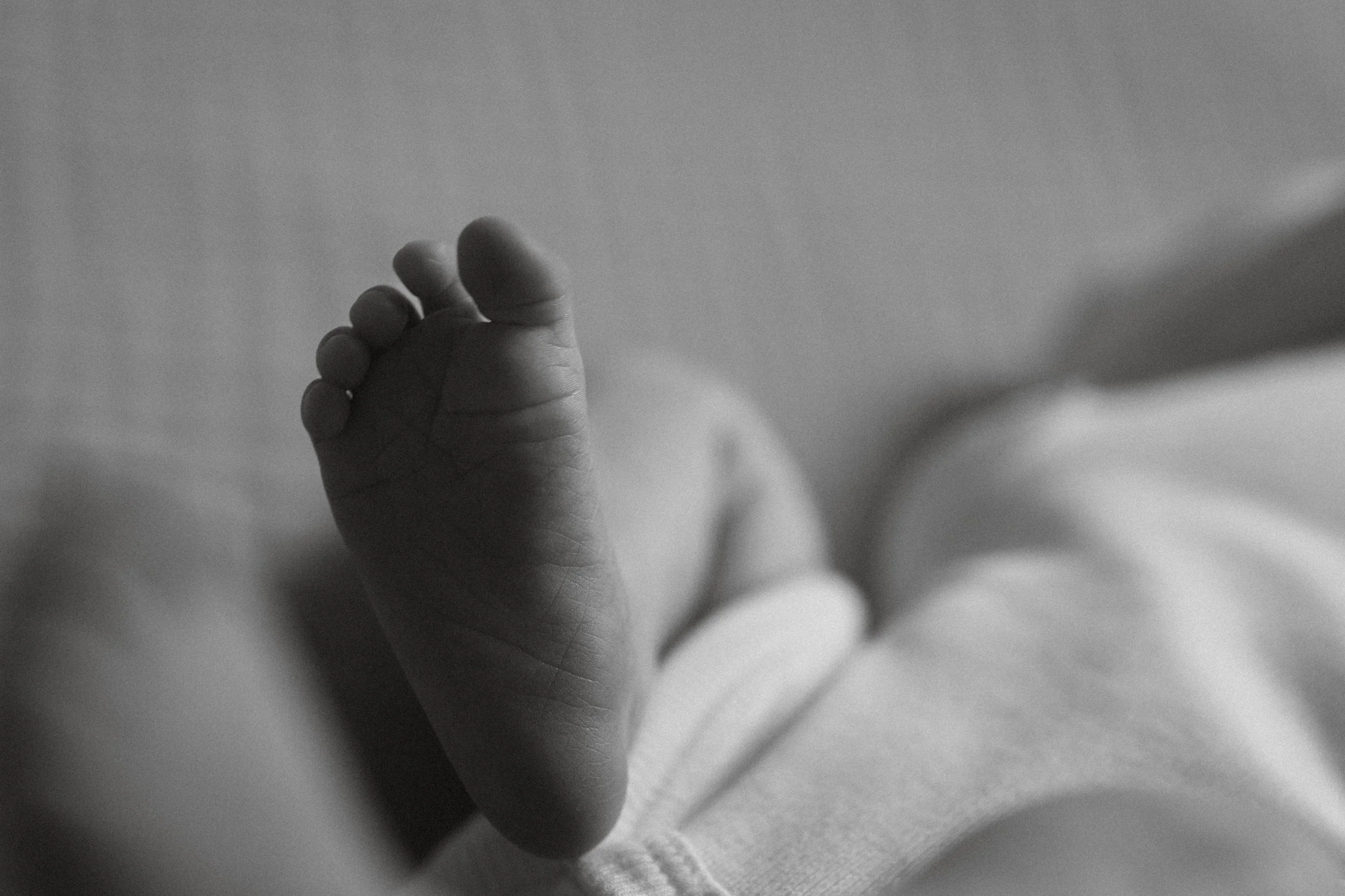 newborn photographed in a relaxed and natural home setting