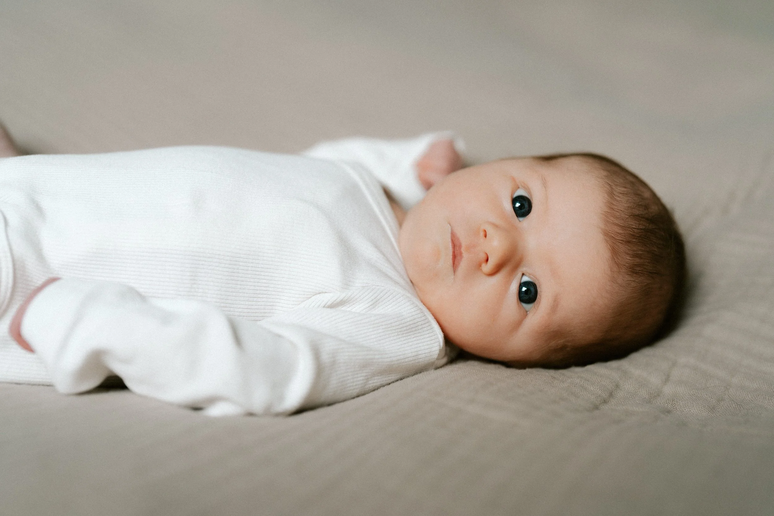 newborn baby photographed at home in soft natural light
