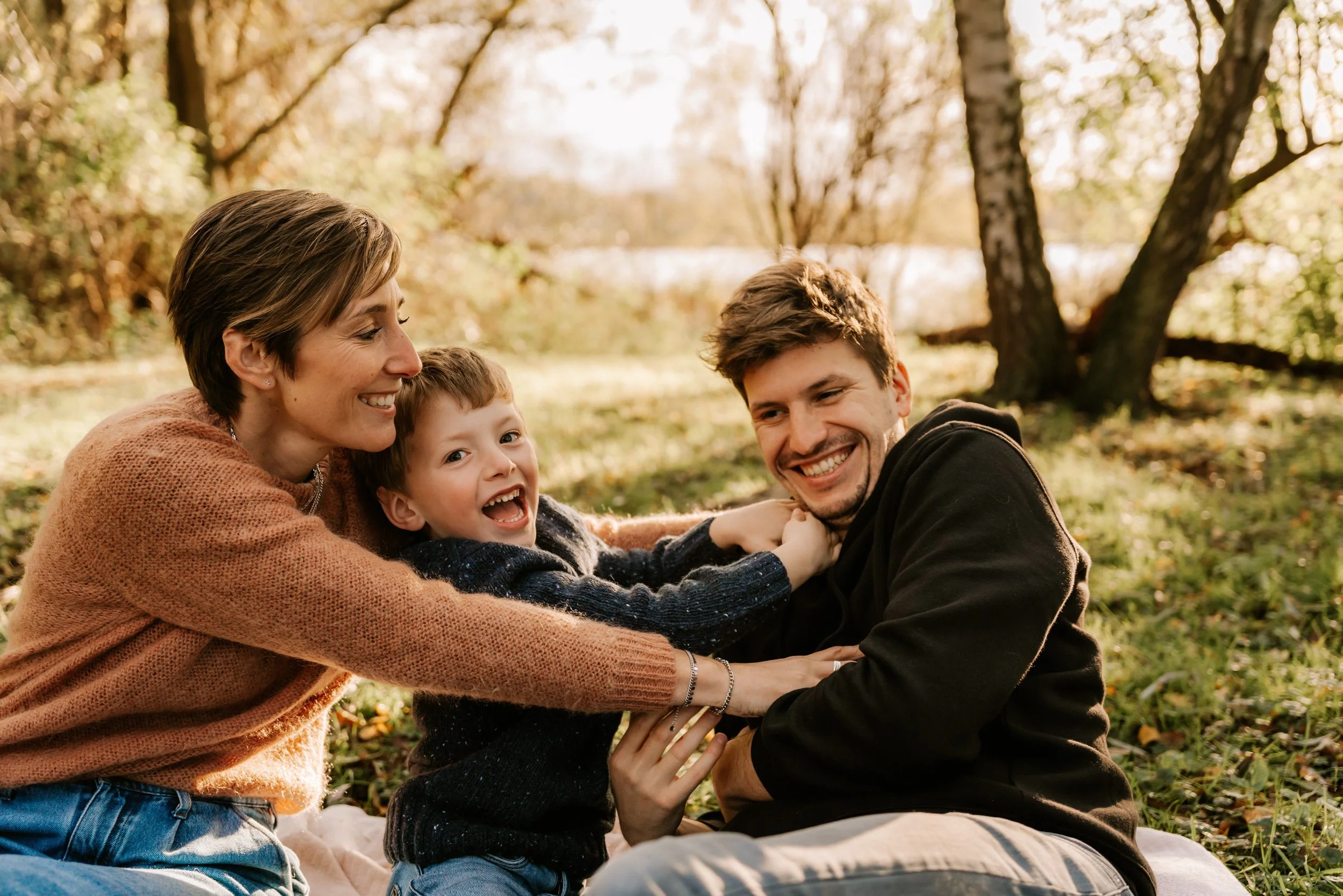couple laughing during a relaxed photoshoot in nature