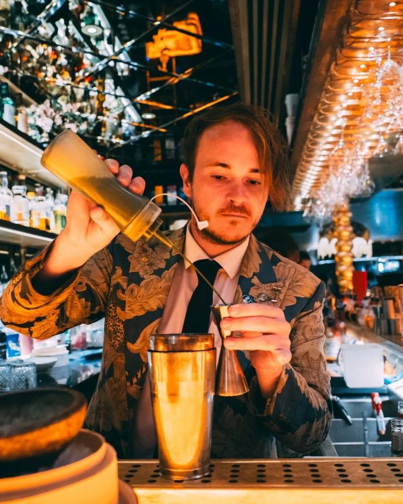 A bartender at The Ivy Asia creating a drink for Brighton Cocktail Festival