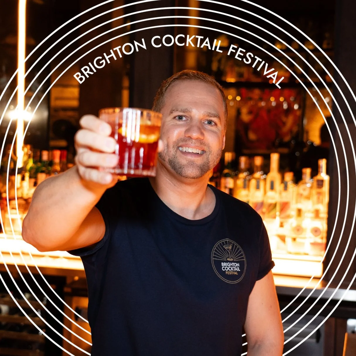 Brighton Cocktail Festival Founder Harry Philippson raising a glass.