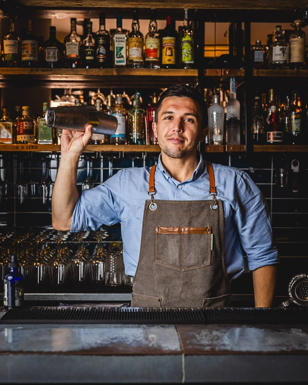 A bartender shaking a cocktail in The Salt Room