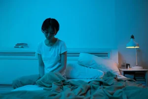 Woman resting in bed