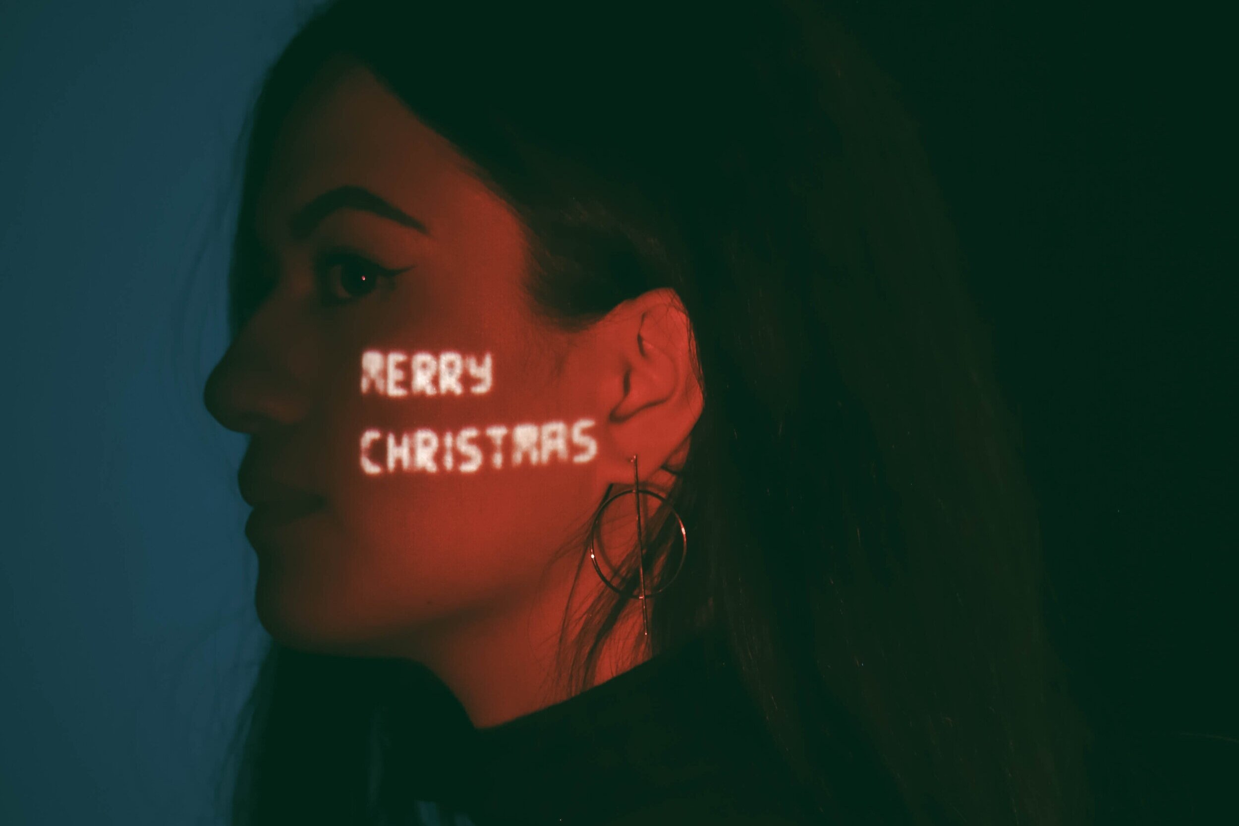 picture of a woman with merry christmas on her face