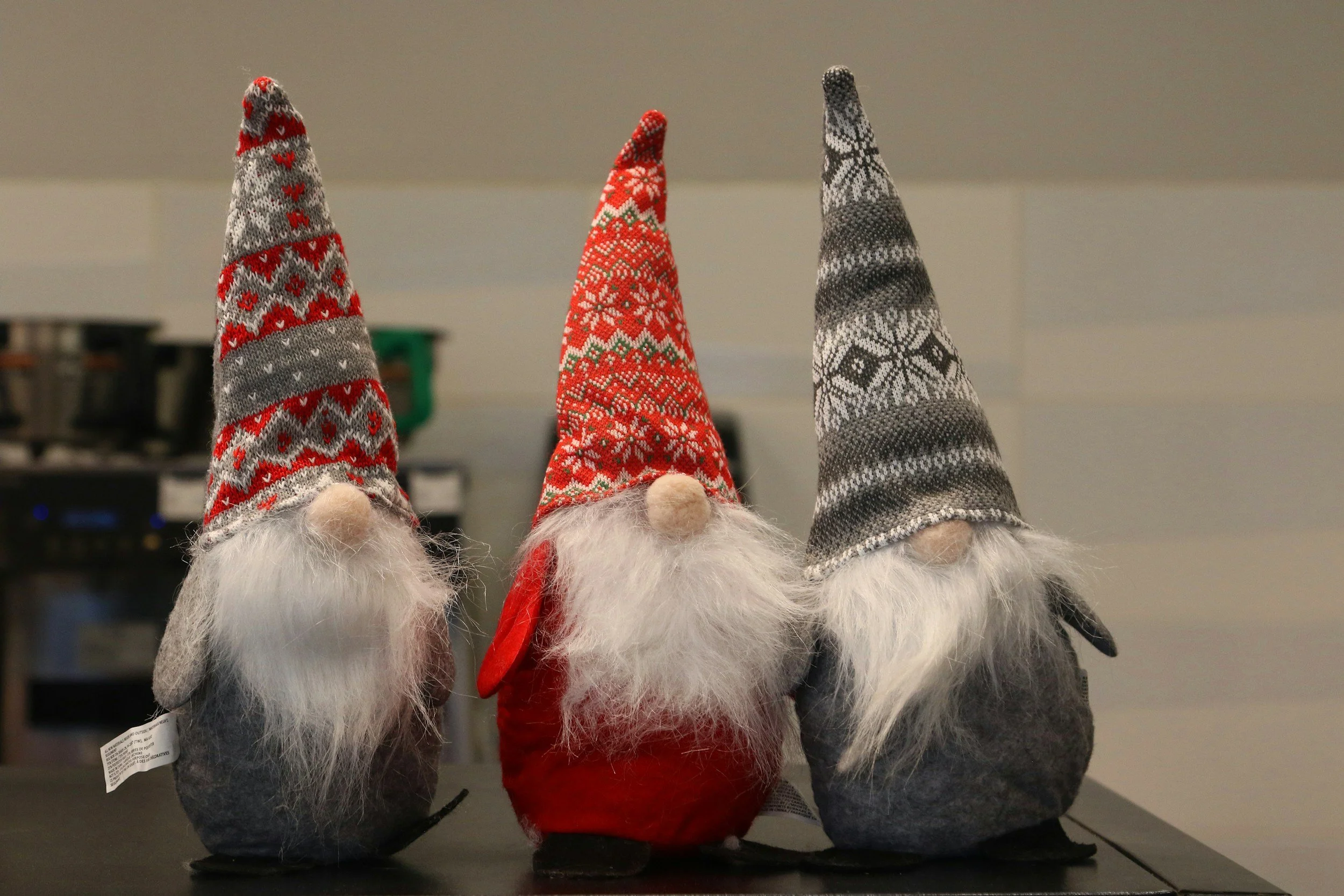 three santa toys together