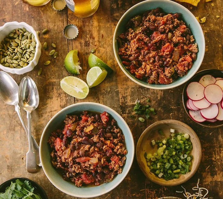 Bowls of ingredients for 100% grass-fed beef chili recipe.
