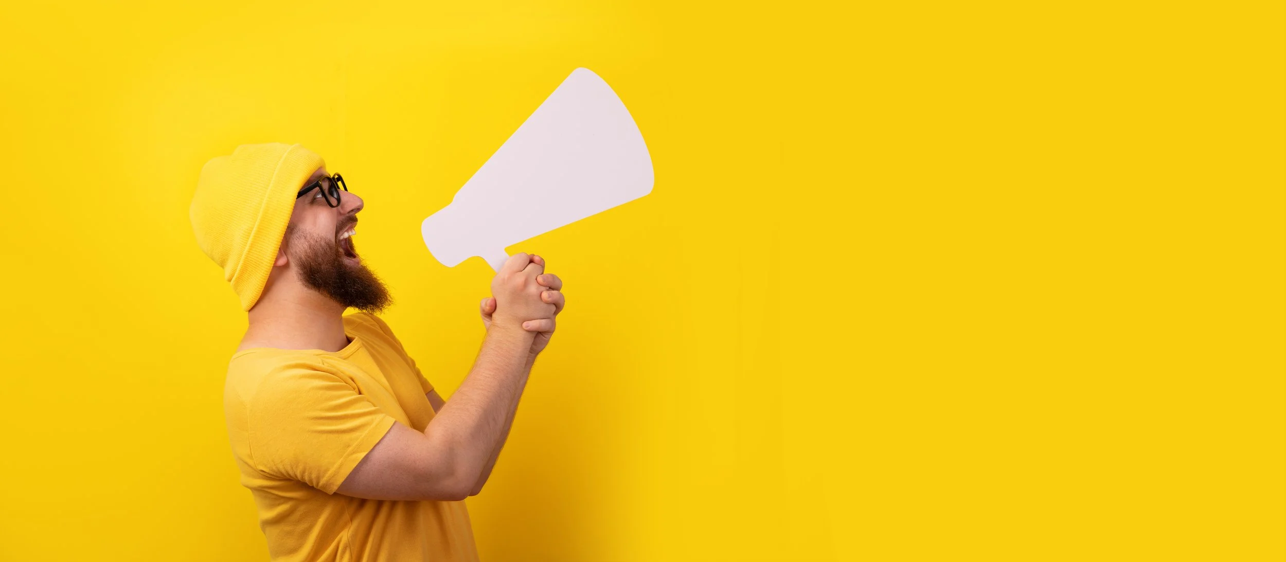 Graphic showing a man holding a megaphone on a yellow background with text reading “The Reminder,” highlighting how simple follow-up emails can nudge potential customers to take the next step.