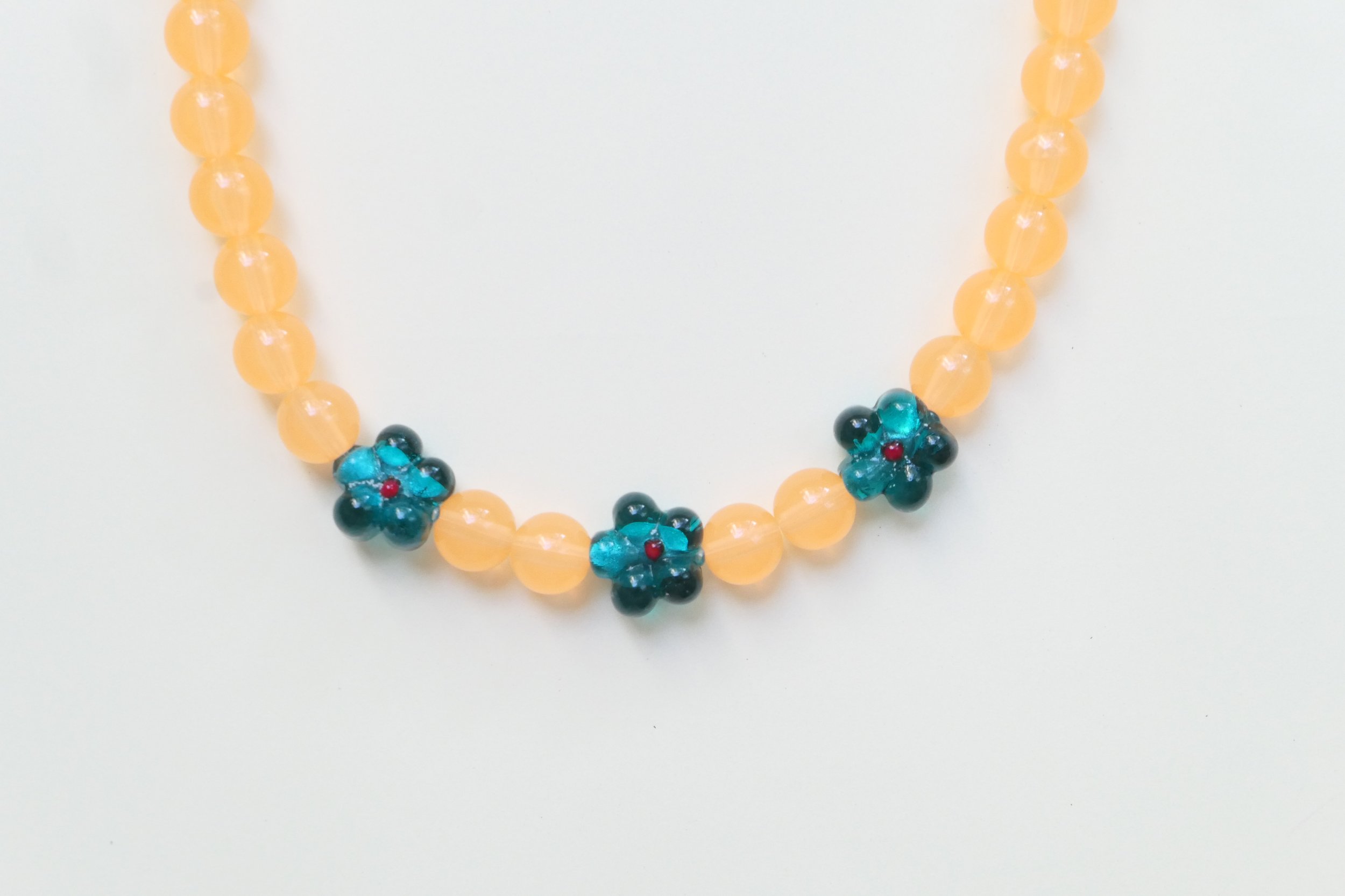 3 Flowers & Orange Translucid Beads