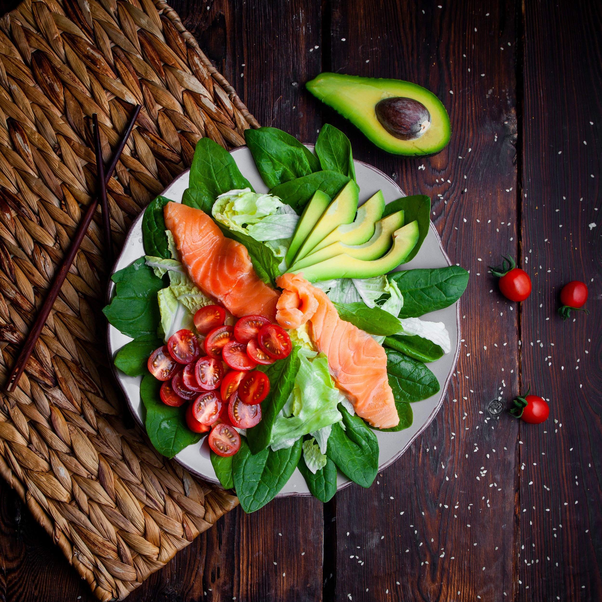 top-view-delicious-meal-plate-with-chopsticks-avocado-wooden-background.jpg
