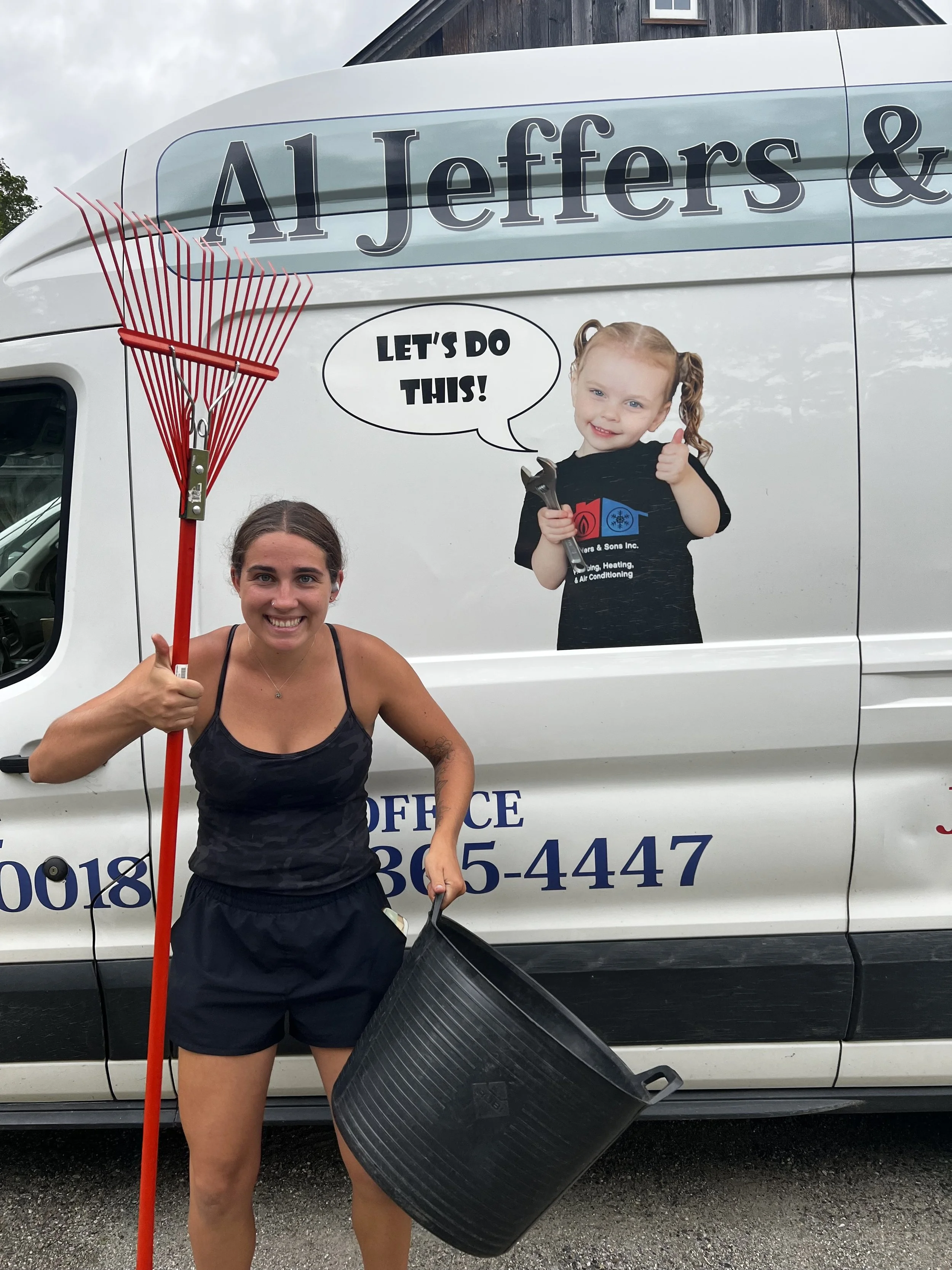 Staff member maintaining garden beds