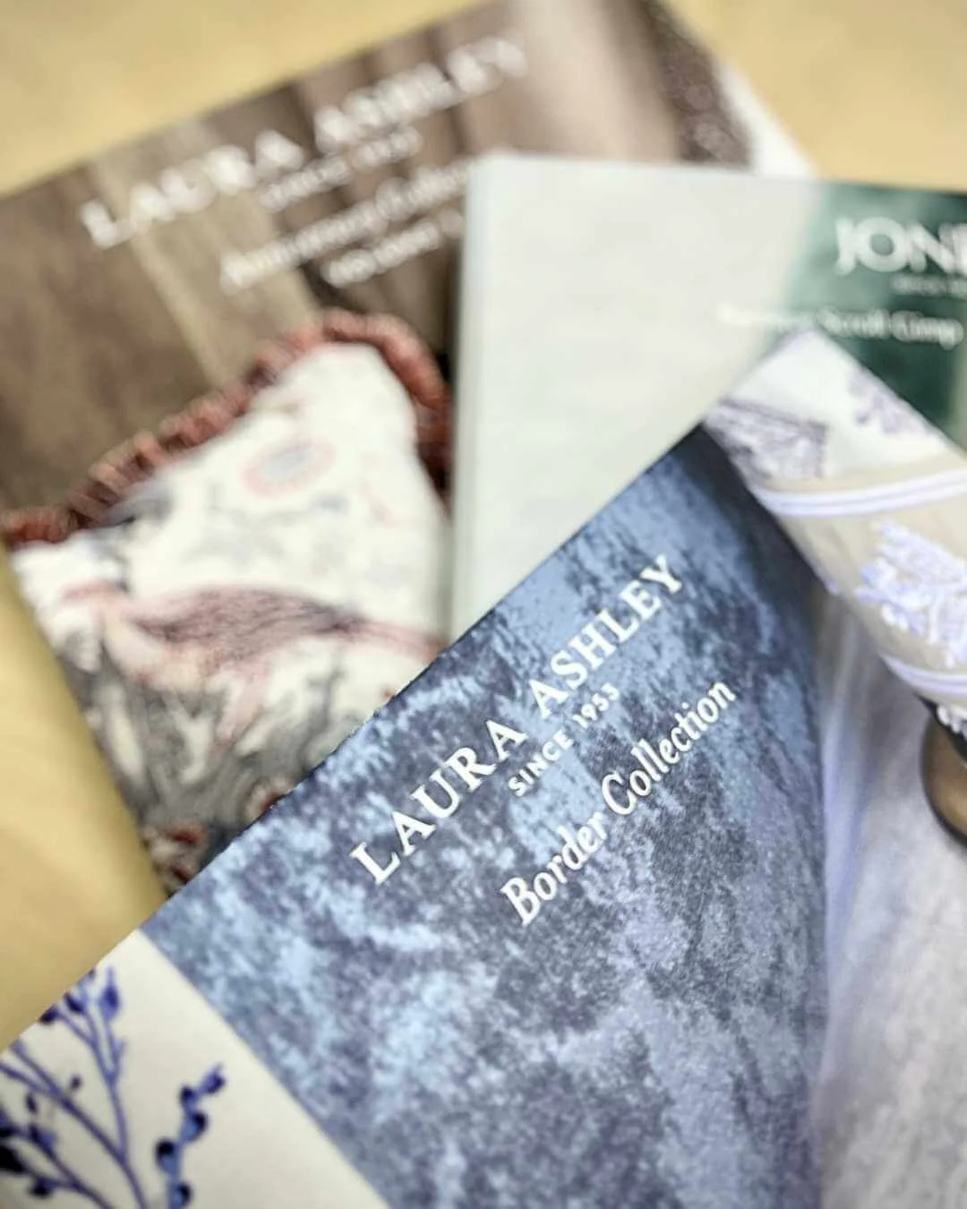 Laura Ashley Border and Anniversary trimming collection books stacked