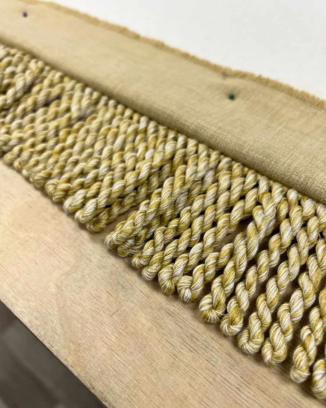 Bespoke commercial curtain in progress with Laura Ashley fringing detail on leading edge