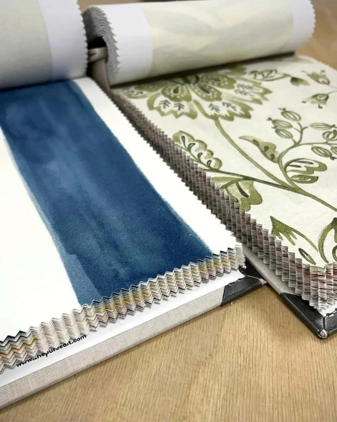 The Pure Edit designer sample books featuring neutral prints and swatches at Aconite Interiors.