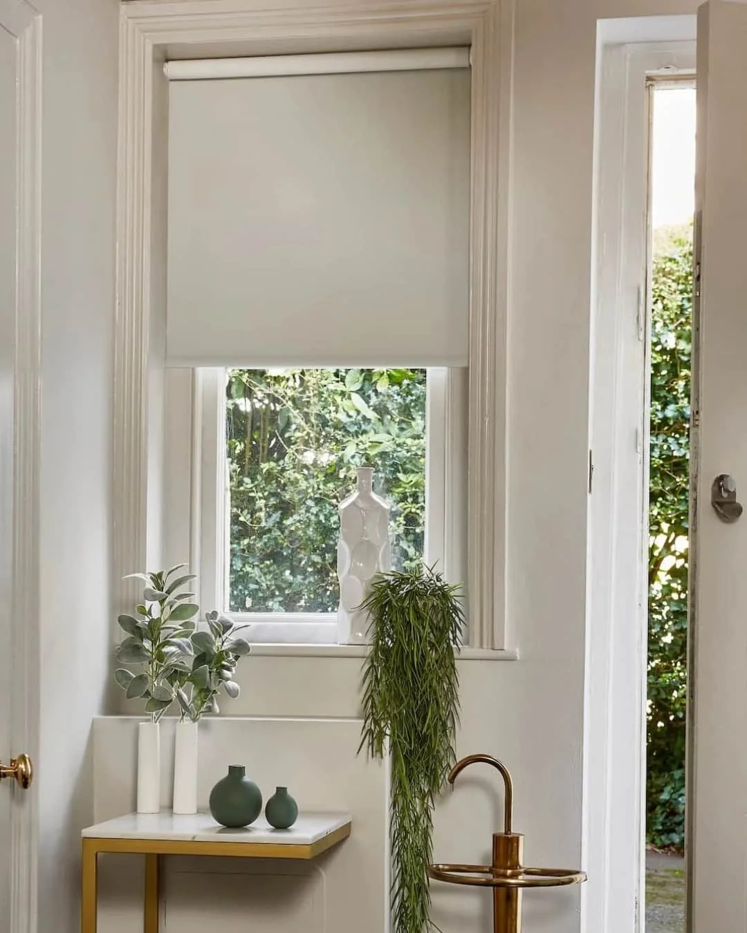 Made to measure roller blinds from PT supplied by Aconite Interiors in a cosy home setting