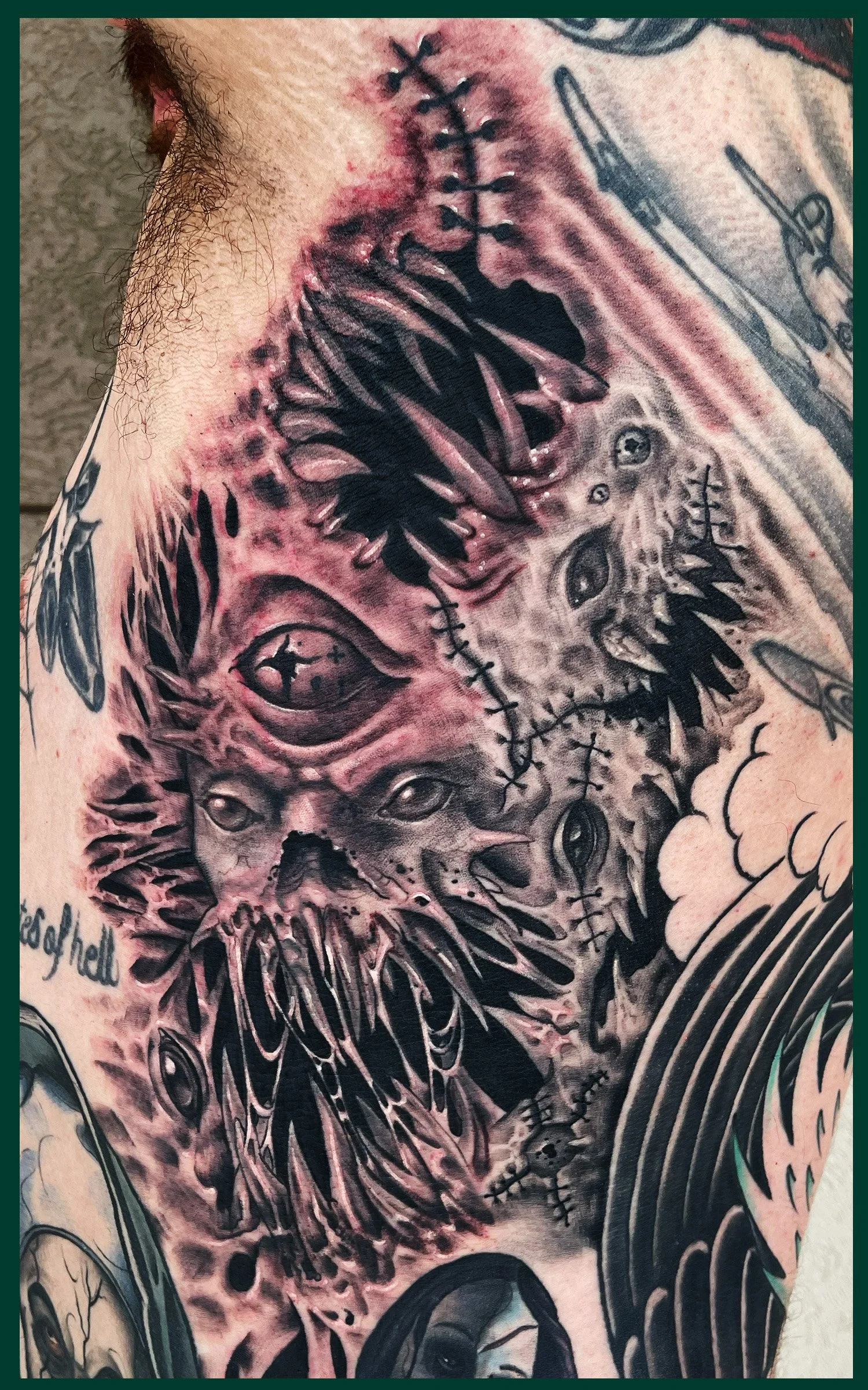 An Abstract Monster with a Third Eye Emerging from a Ribcage done in black and gray realism