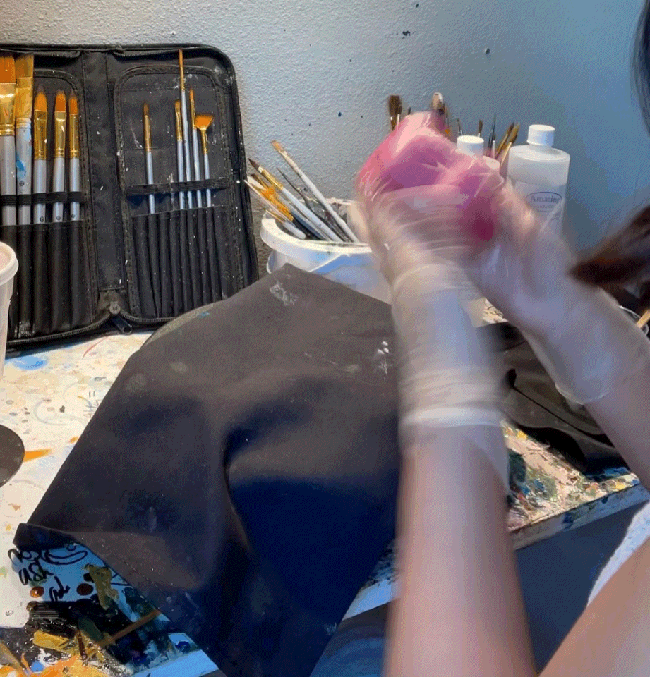 Pouring resin onto ceramic pieces