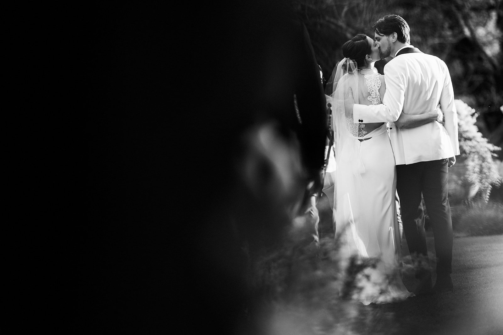 bride and groom first kiss