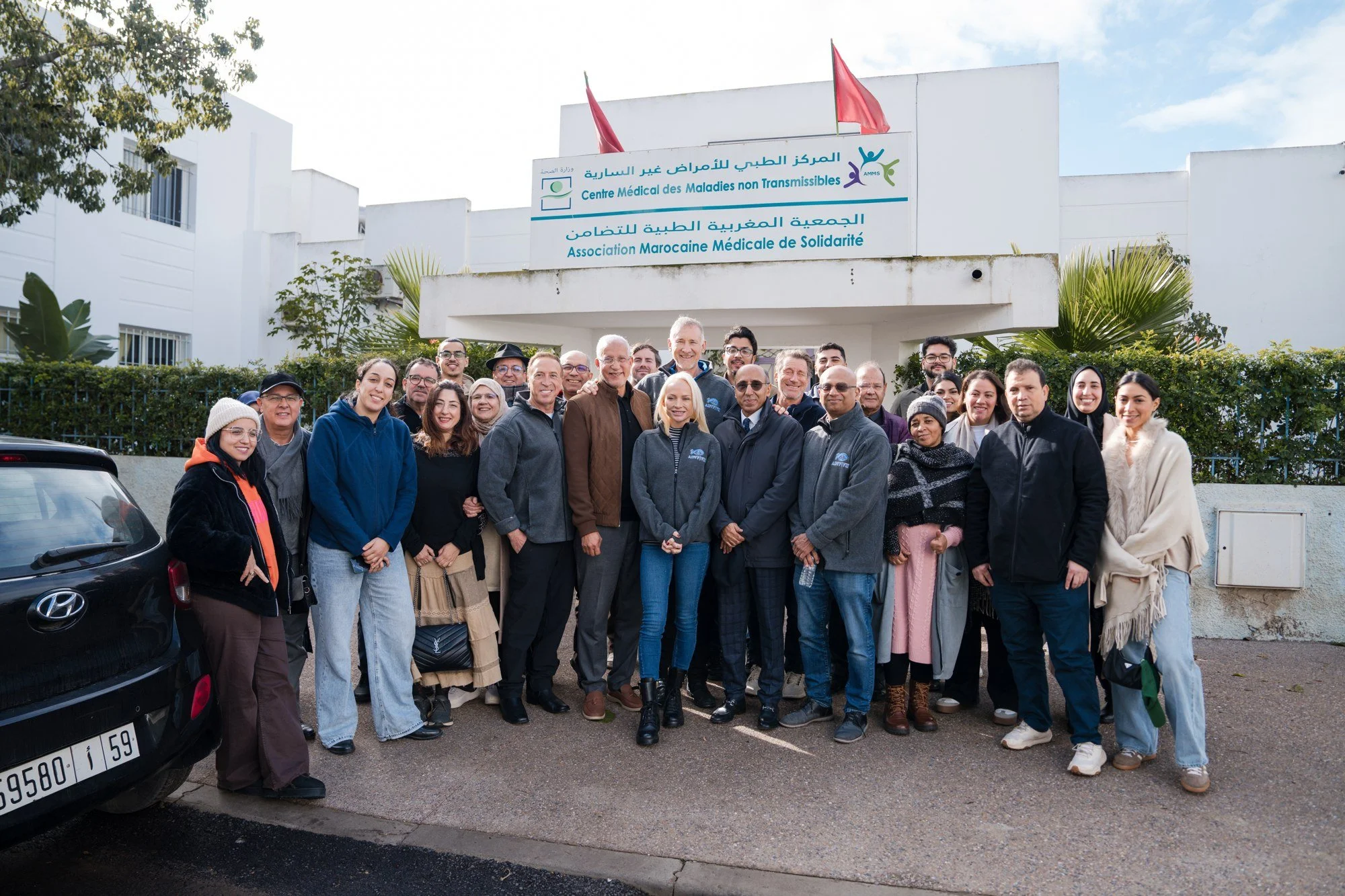 ADVF volunteers and Moroccan partners gather outside a clinic during an earlier Morocco mission.