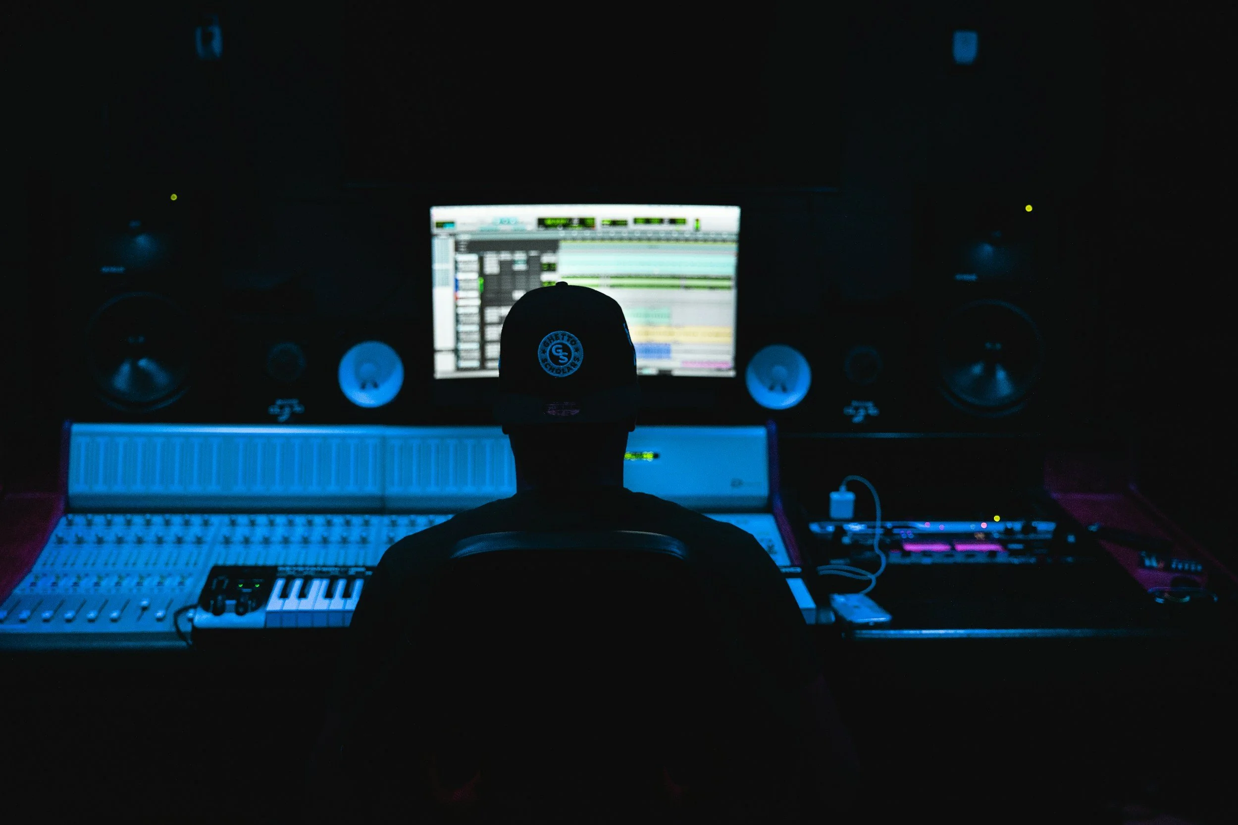 Student sitting at sound console 