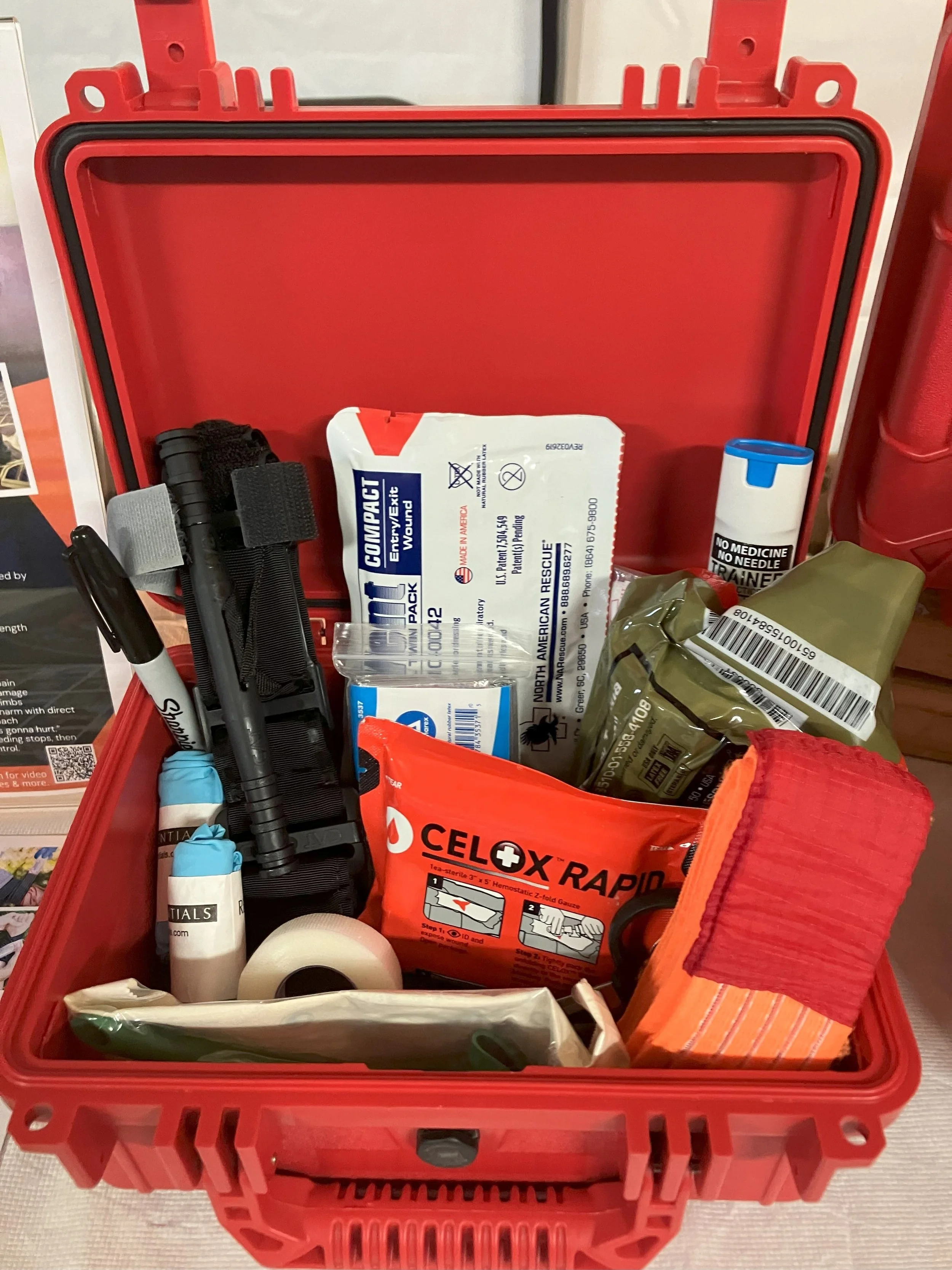 Professional first aid and trauma response kit in durable red hard case