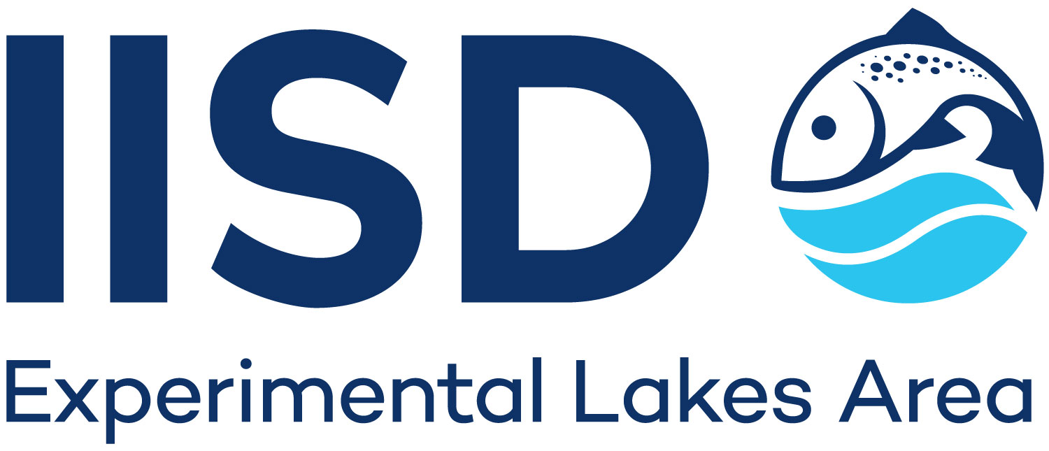 White rectangle with the letters IISD, Experimental Lakes Area, on the inside. The logo is a picture of a salmon fish jumping over two blue waves.