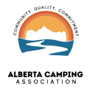 Alberta Camping Association logo. It is a sunset with a river path leading to the mountains, with the words "Community, Quality, Commitment" on the top.