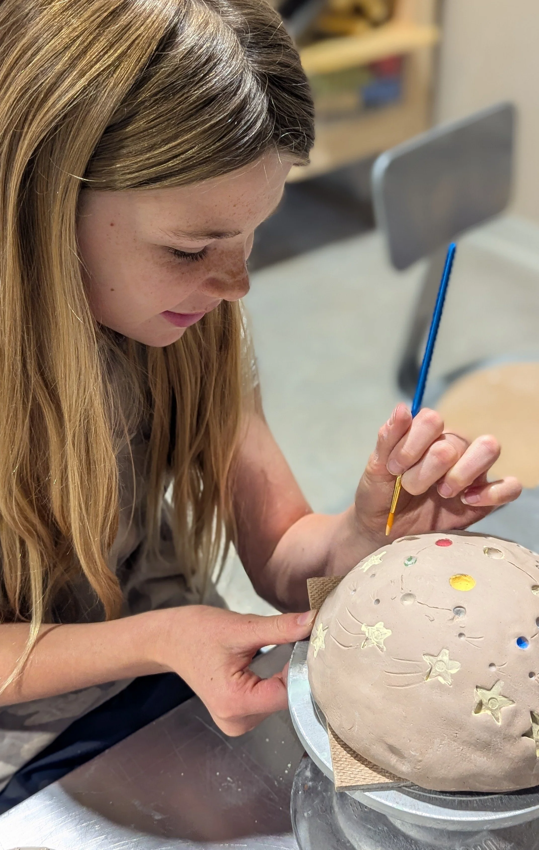 Kid's Camp participants busy making awesome clay projects