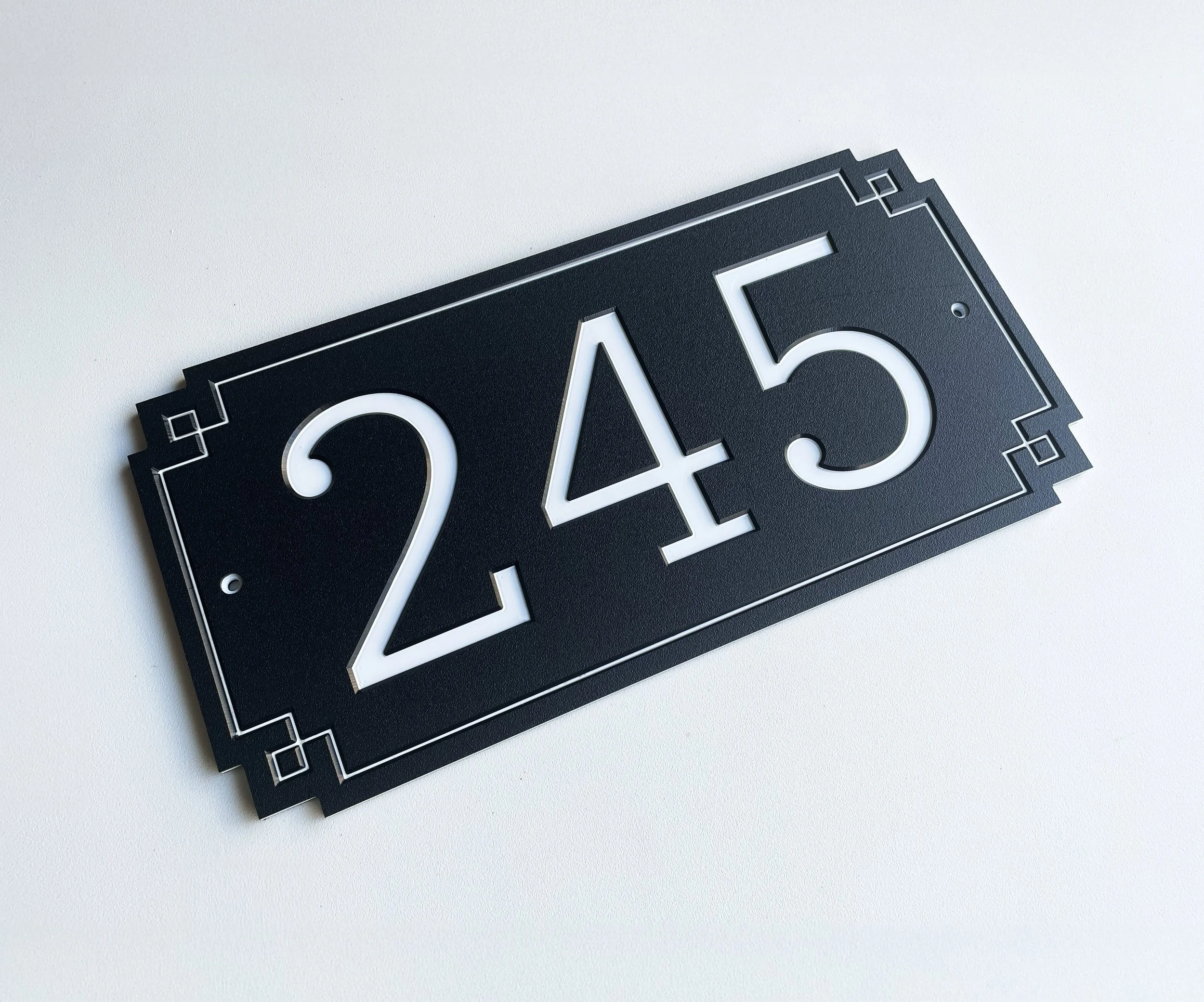 black-address-sign-white-numbers-deco-border-house-number-plaque.jpg