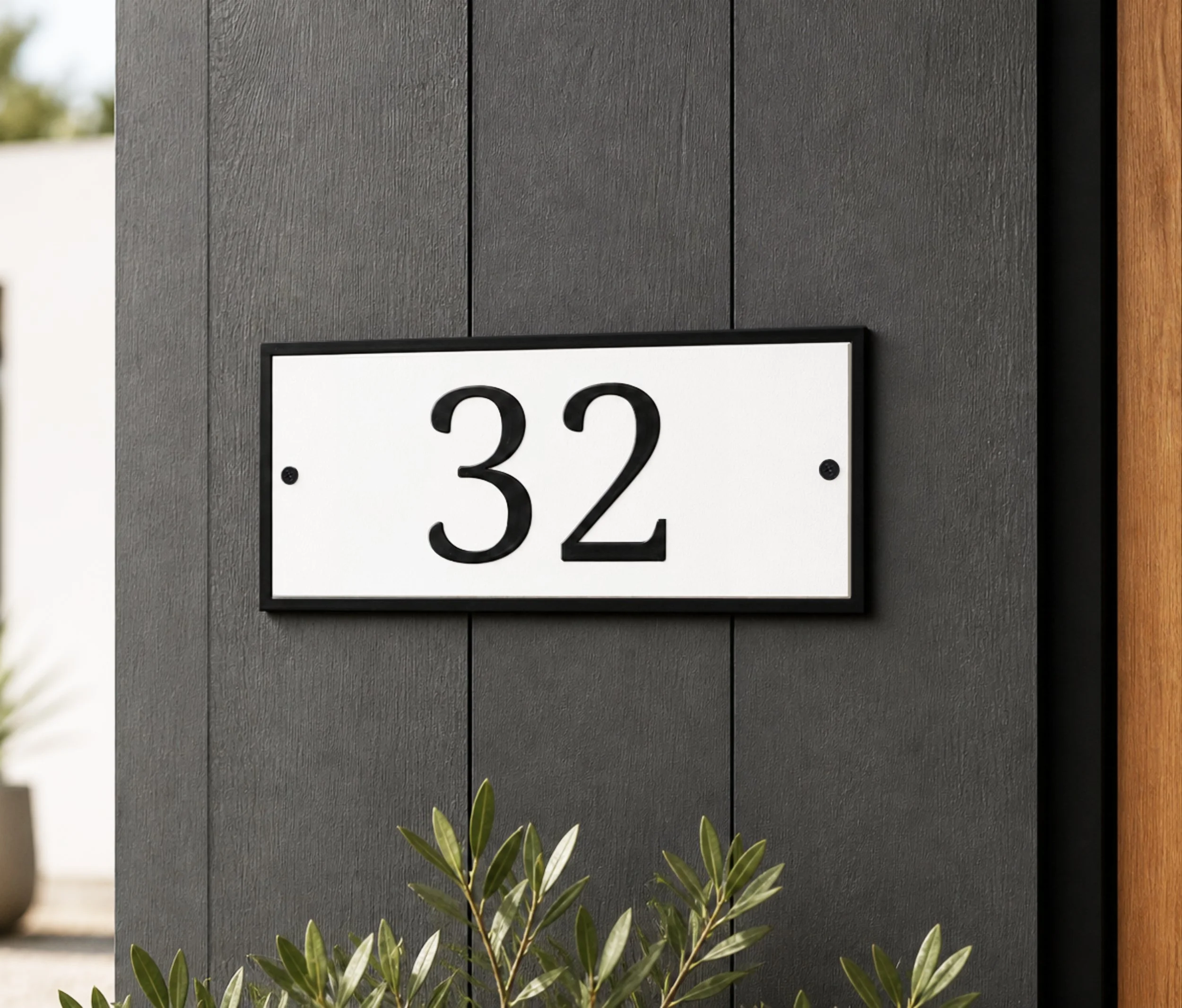 classic-address-sign-black-white-serif-house-numbers-dark-wall.jpg