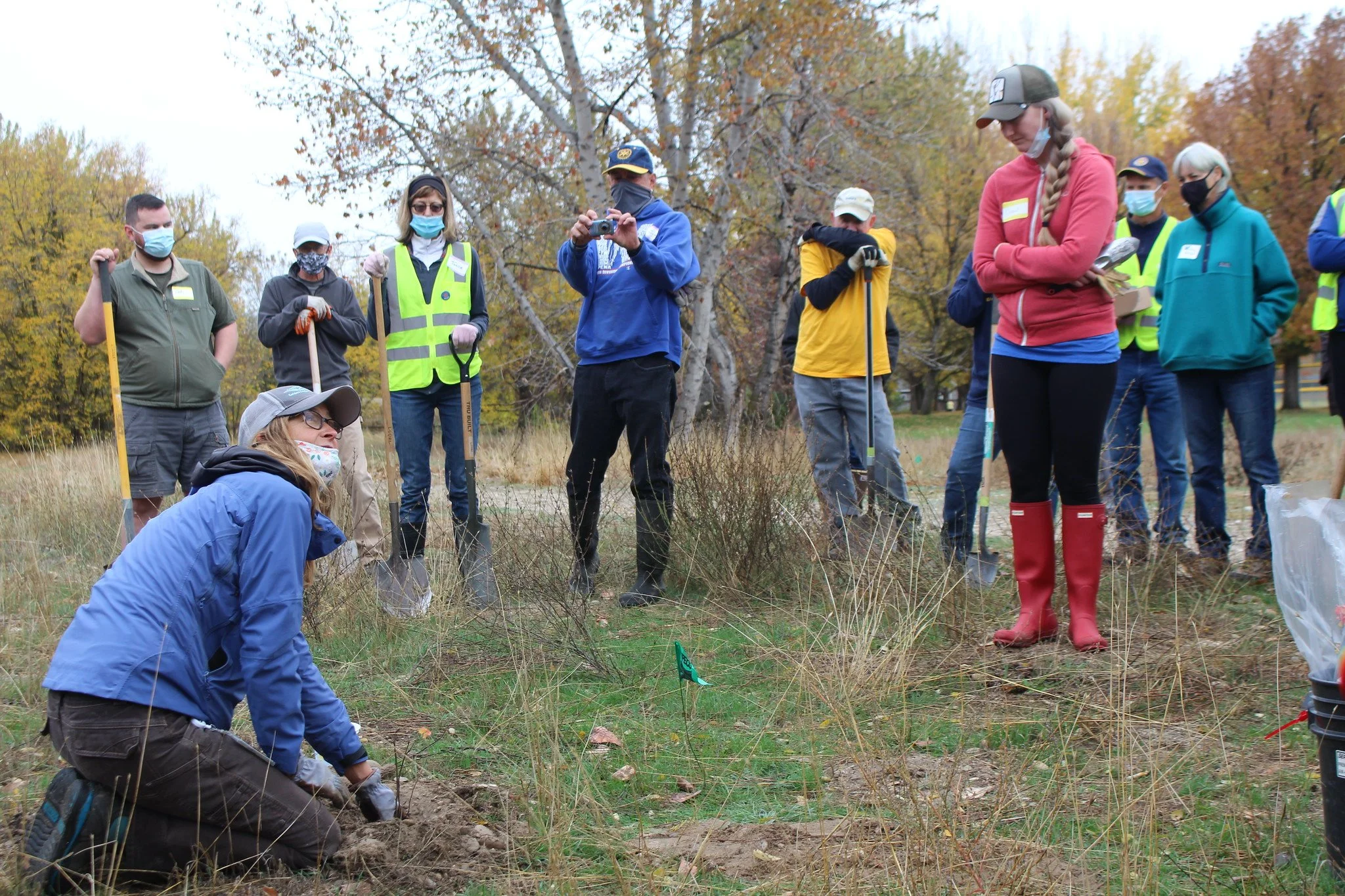 A planting crew getting expert instructions from Kristen Gnojewski; our wetland vegetation expert from Boise Parks & Rec.
