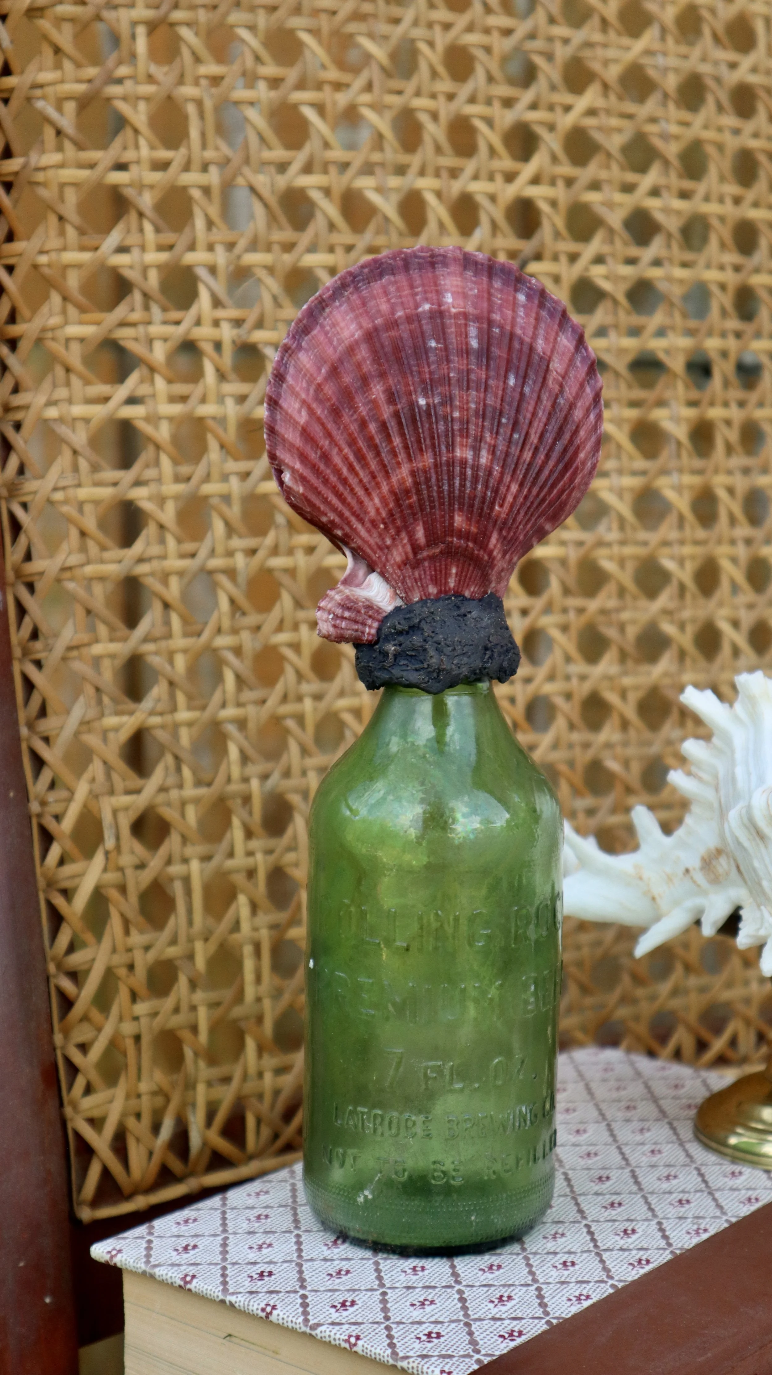 Small Red Scallop Shell on Green Bottle