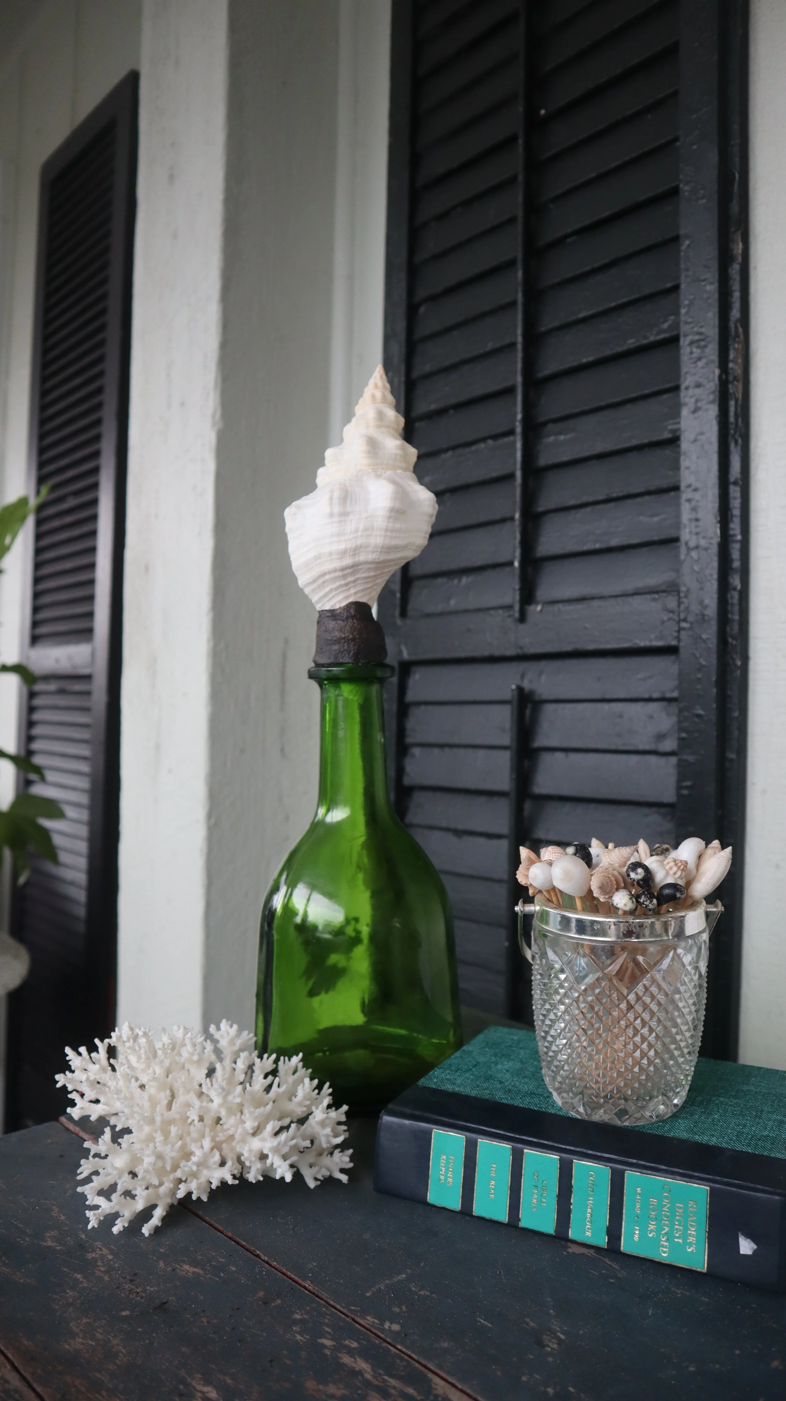 Horse Conch Topped Green Bottle