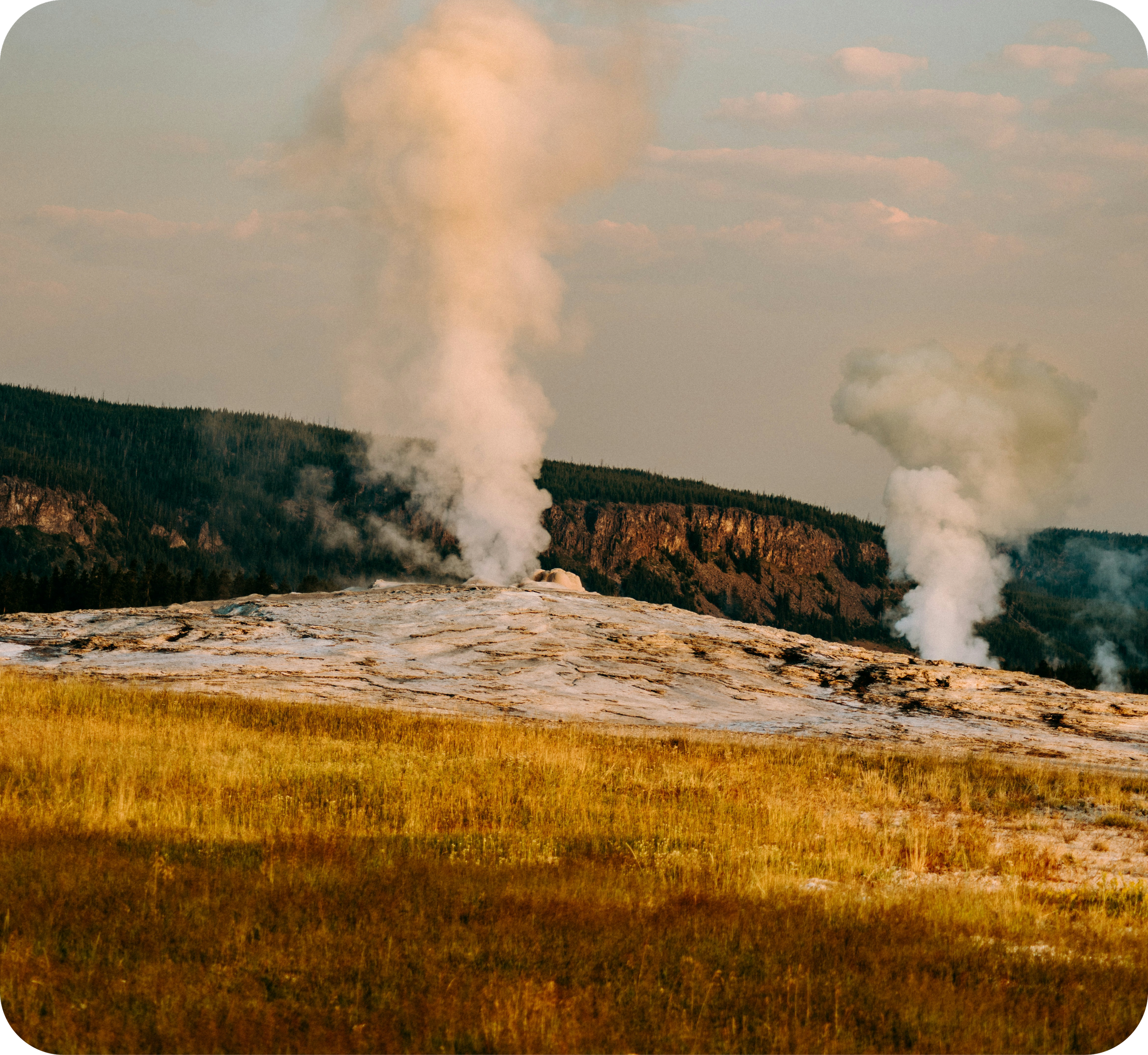 Geothermal steam vents rising from natural terrain representing the utility-scale geothermal energy development potential available to tribal nations pursuing energy sovereignty
