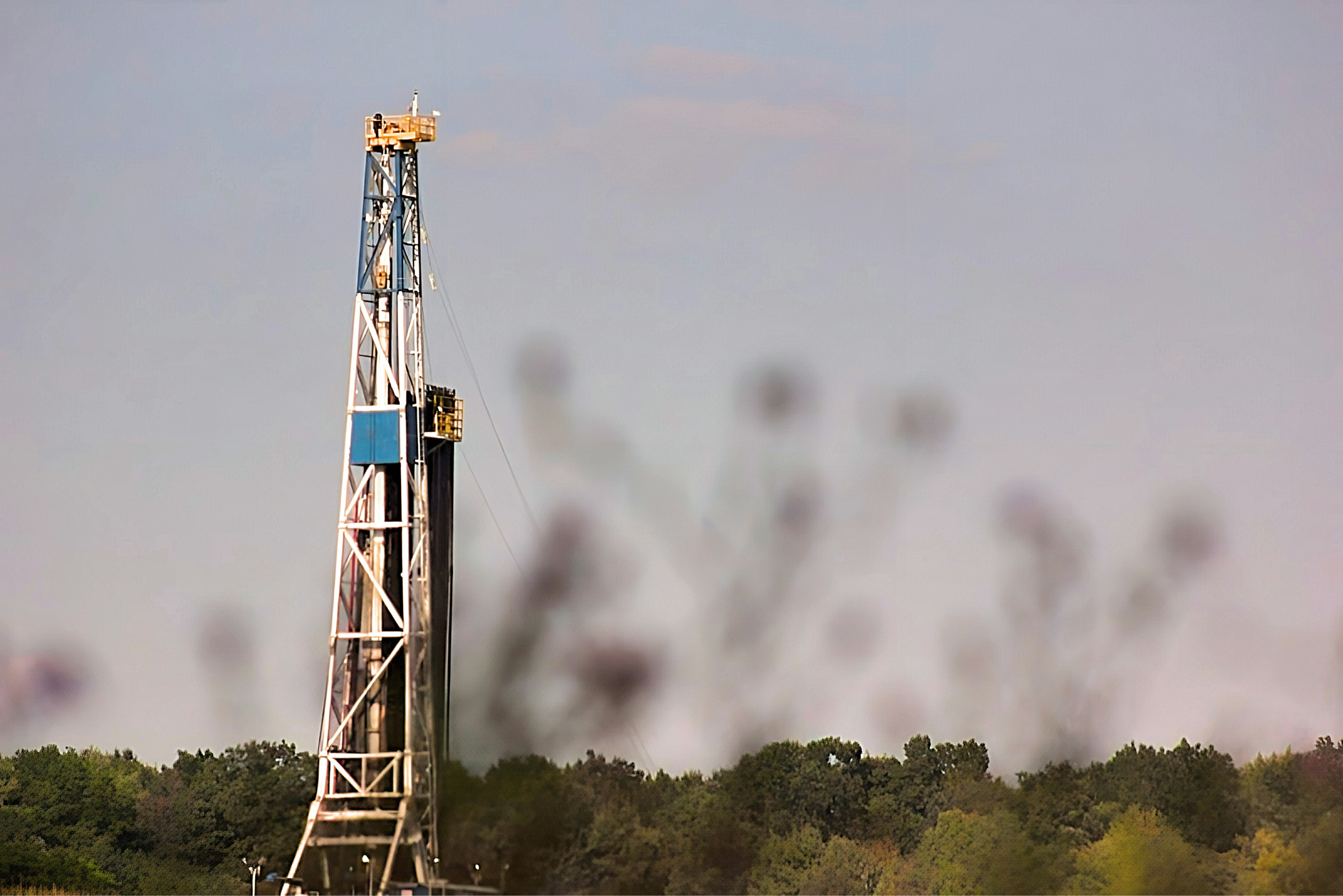 Natural gas drilling rig on open land representing utility-scale energy resource development opportunities available to tribal nations that form their own utilities