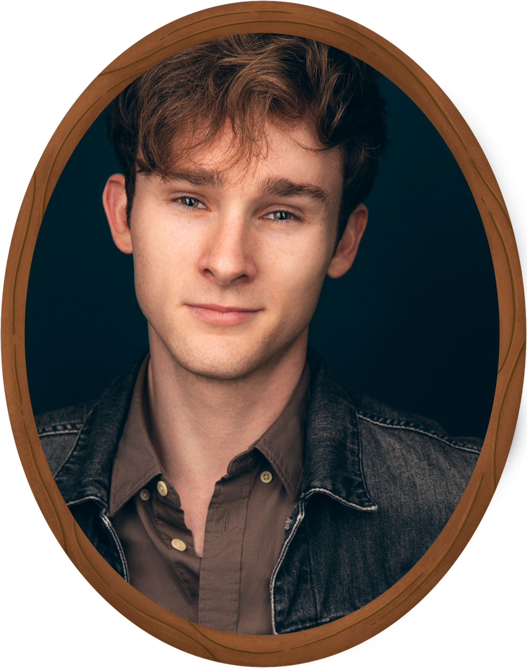A young man with light skin, brown hair, and blue eyes, smiling slightly, wearing a brown button-up shirt and a black denim jacket, framed within a brown oval border on a dark background.