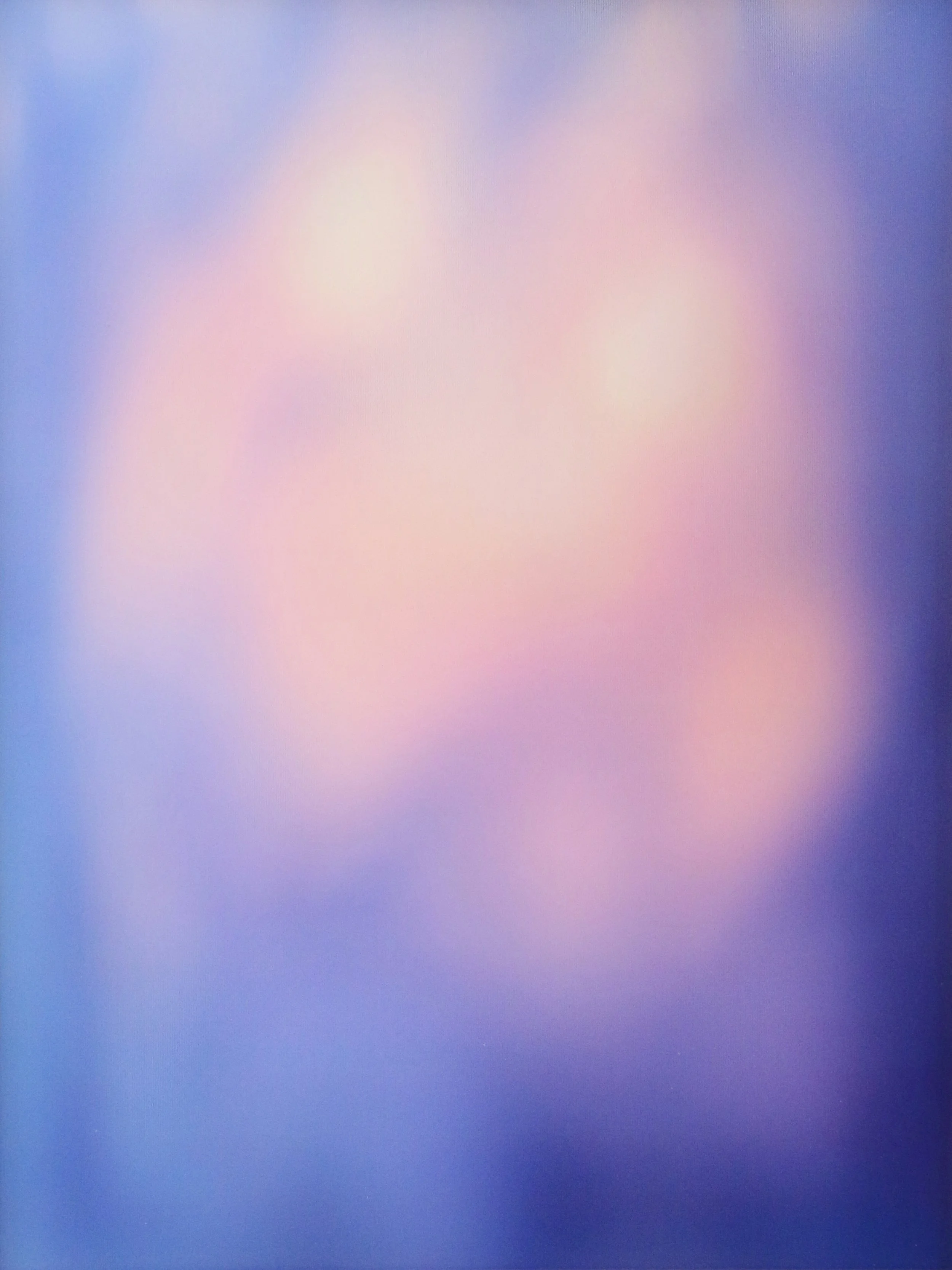 Blurred, colorful abstract background with shades of blue, pink, and purple