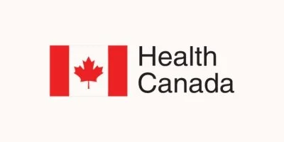 Health Canada logo with a red maple leaf and red bars on a beige background.