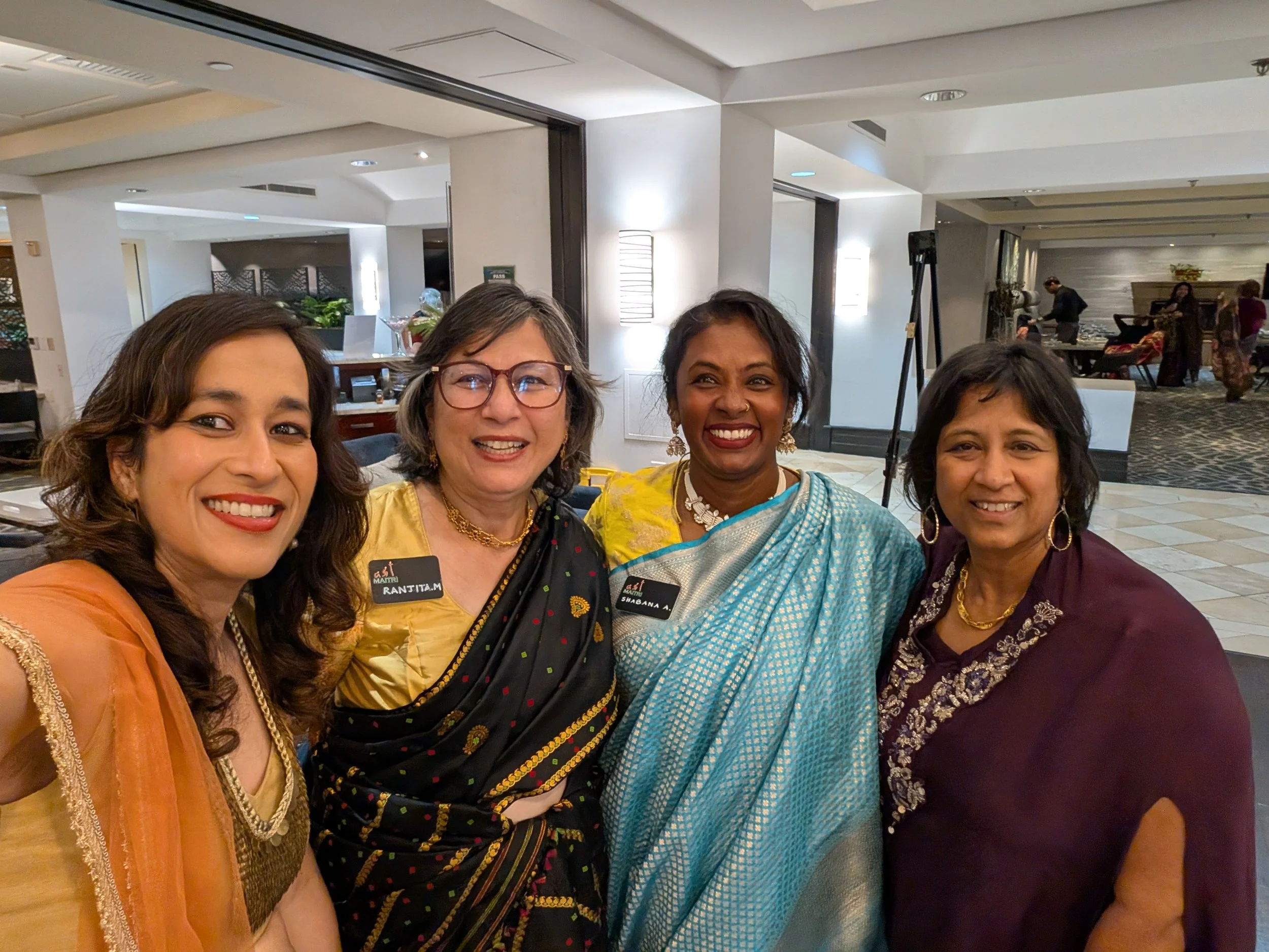 Silent auction displays at the Maitri Gala, representing the power of outcome narratives and the human premium in both non-profit advocacy and corporate strategy.